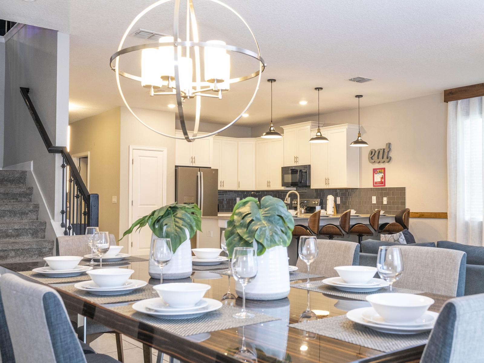 Indulge in Seamless Elegance: Experience the Inviting Warmth of a Dining Haven Tucked Next to the Cozy Ambiance of the Living Room, Where Comfort and Style Converge.