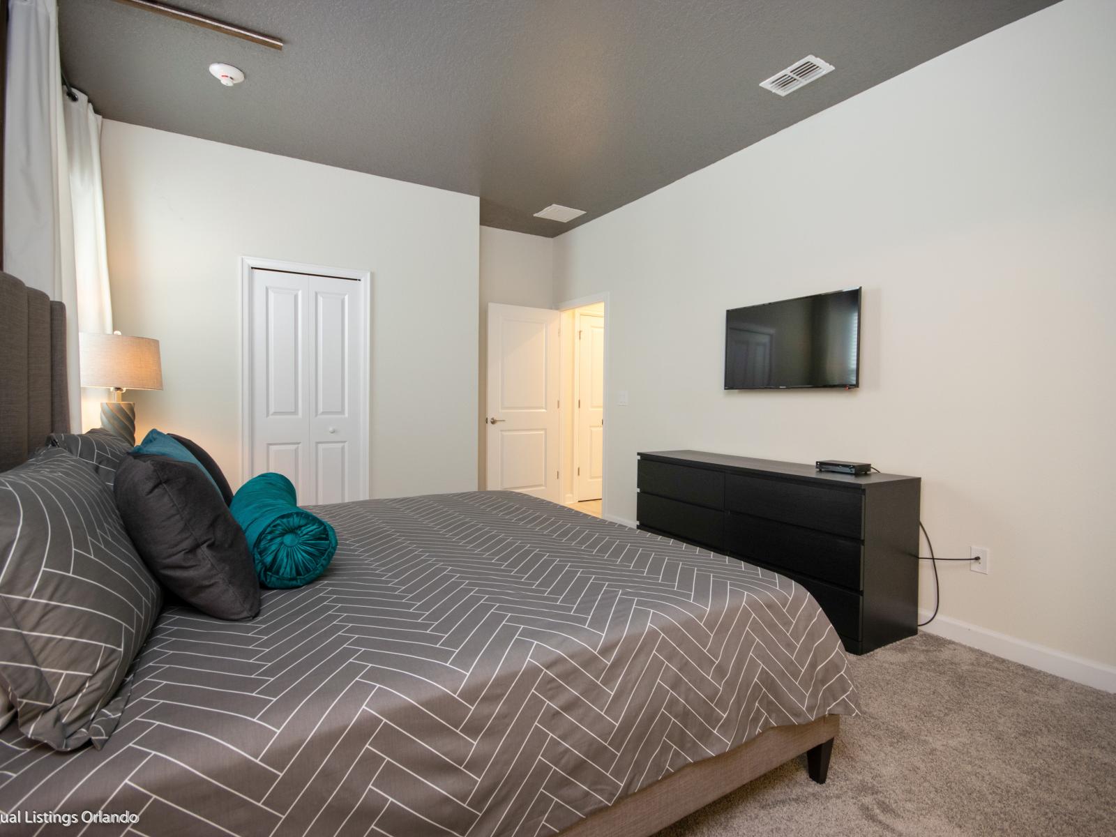 Step into Tranquility: Explore the Refined Ambiance of Our Bedroom, Embellished with Graceful Gray Accents and Stylish Details, Offering an Oasis of Serenity and Modern Elegance.