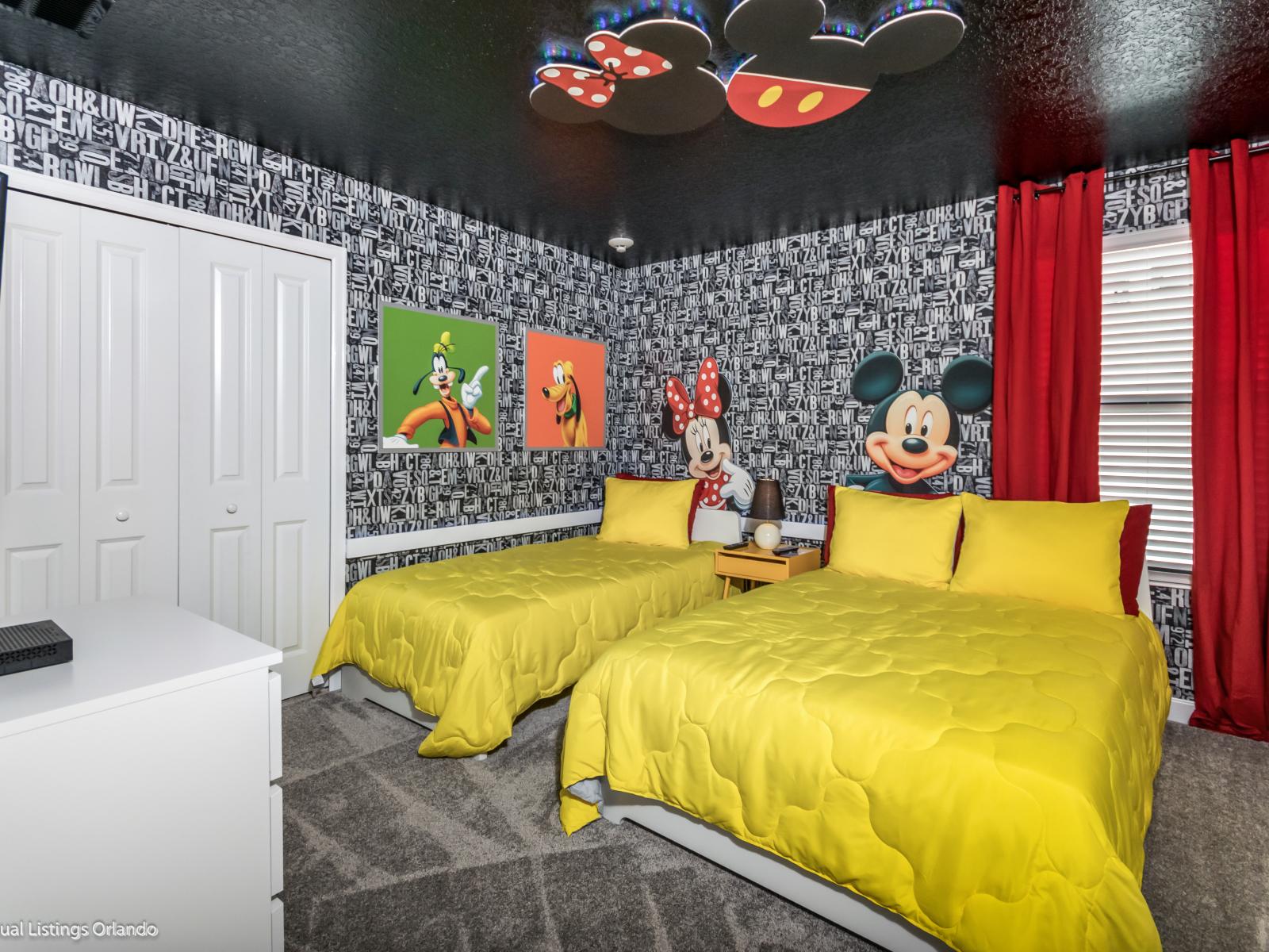 Mickey Mouse themed bedroom of the home in Kissimmee Florida - Well-appointed with modern amenities for convenience - Inviting bedroom with a soothing color palette for a tranquil feel - Offering one double bed and one single bed