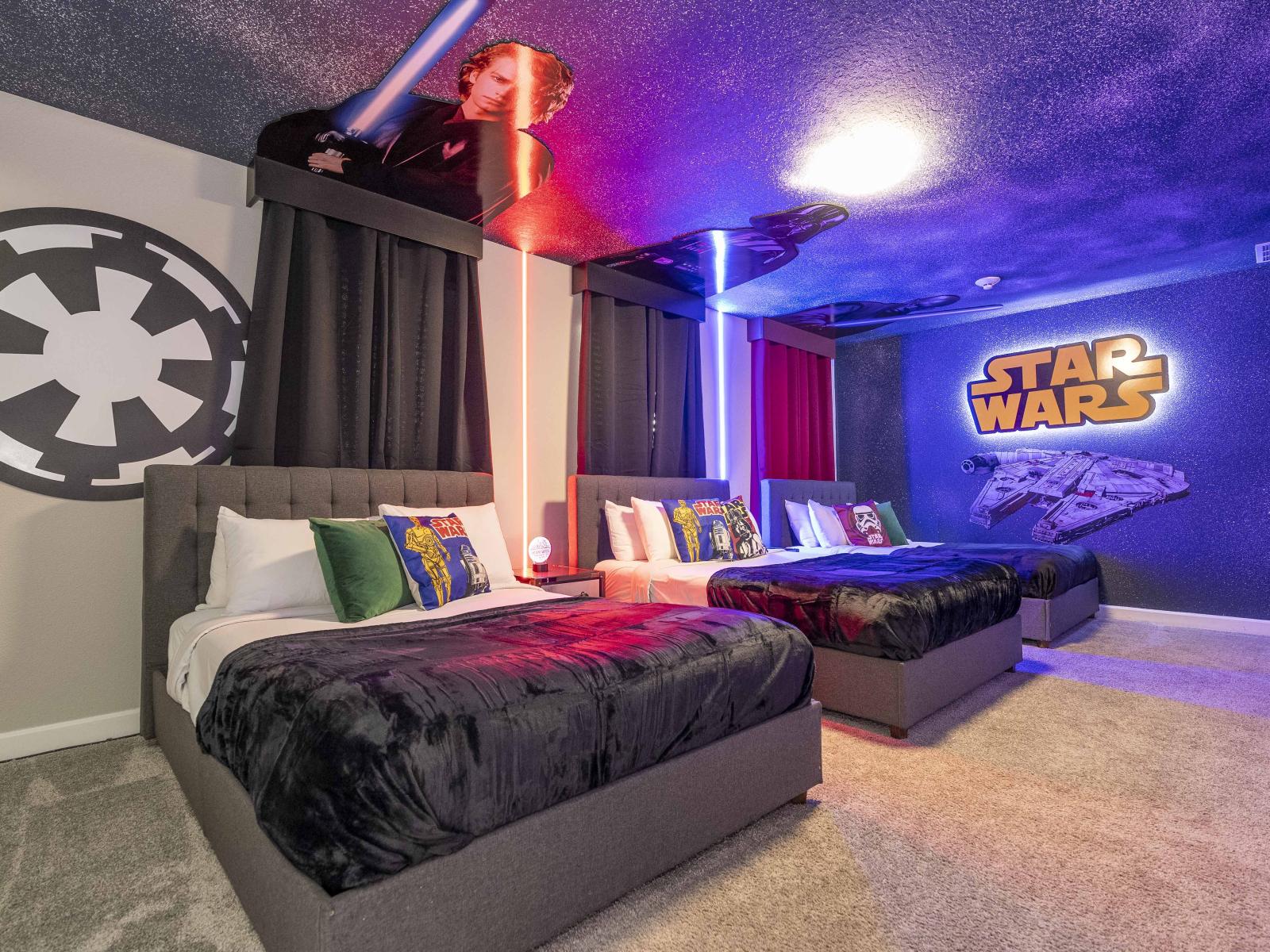 Star Wars themed bedroom of the home in Kissimmee Florida - Spacious bedroom offering comfort and style - Plenty of sleeping space with three double beds - Thoughtfully designed bedroom featuring functional and stylish furniture