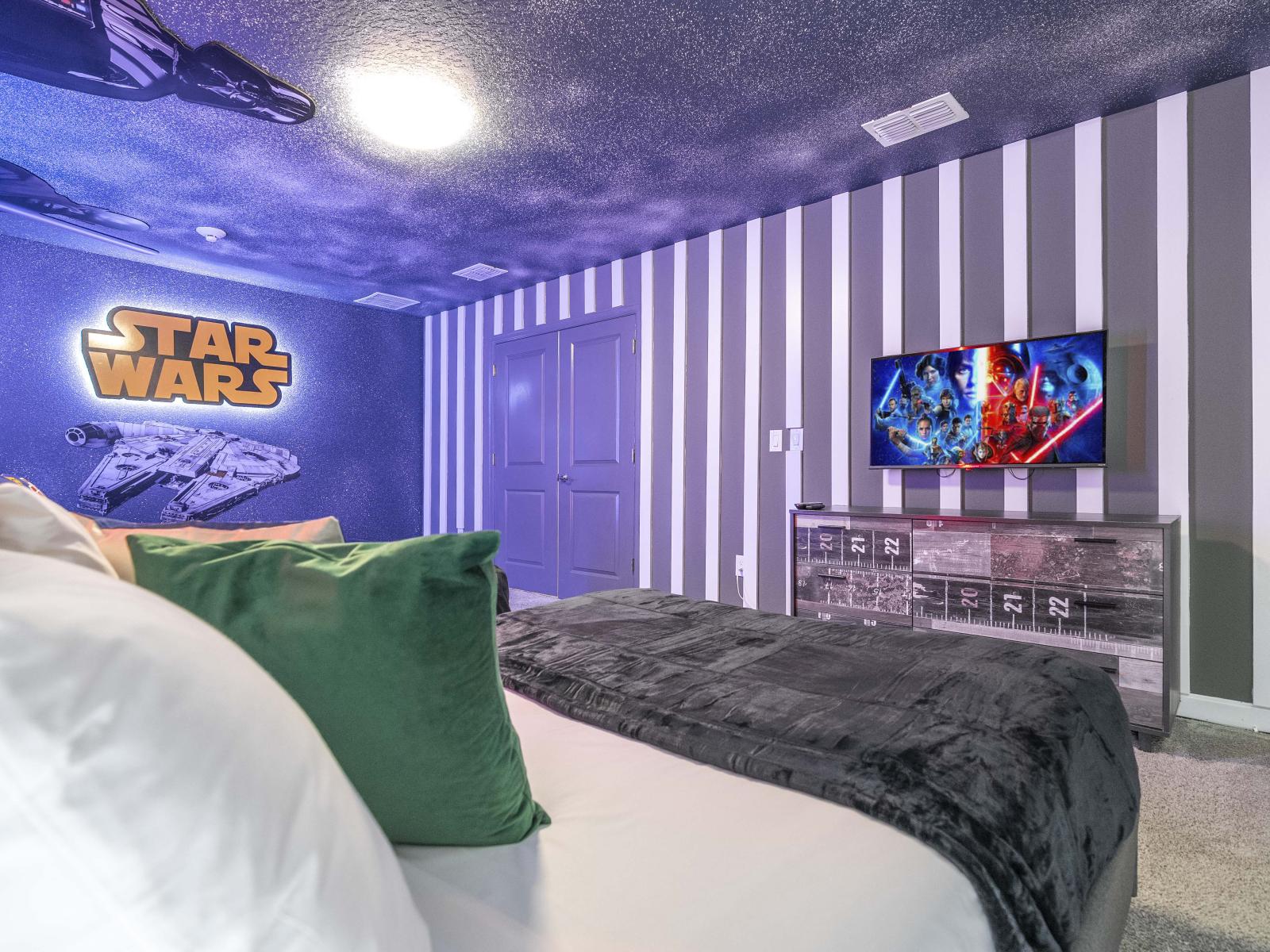 Star Wars themed bedroom of the home in Kissimmee Florida - Spacious bedroom offering comfort and style - Plenty of sleeping space with three double beds - Thoughtfully designed bedroom featuring functional and stylish furniture