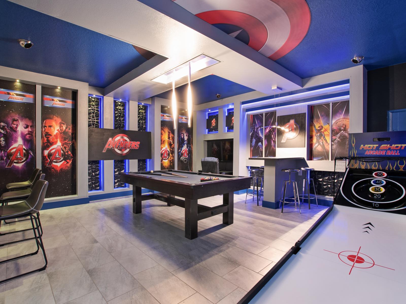 This man cave will never bore you, enter this extended happy place with a pool table and more.