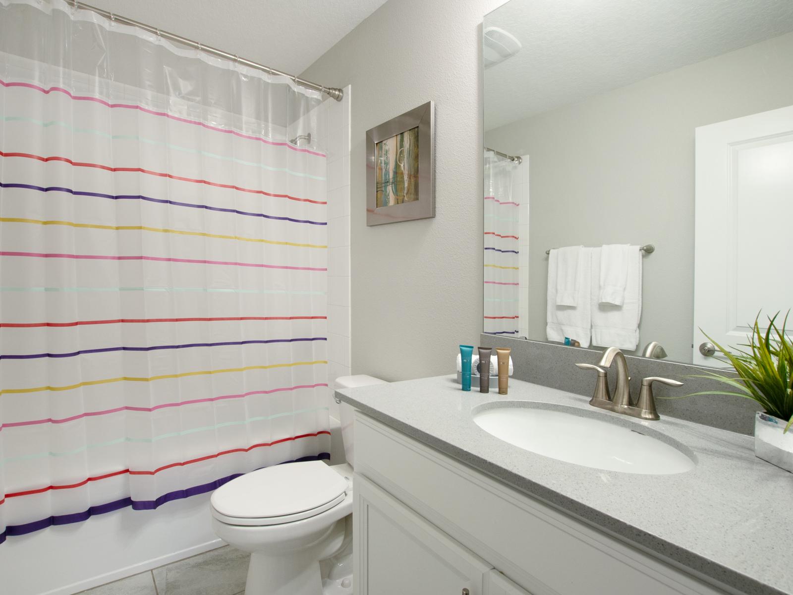 Refresh and rejuvenate: Experience ultimate comfort in our stylish bathroom.