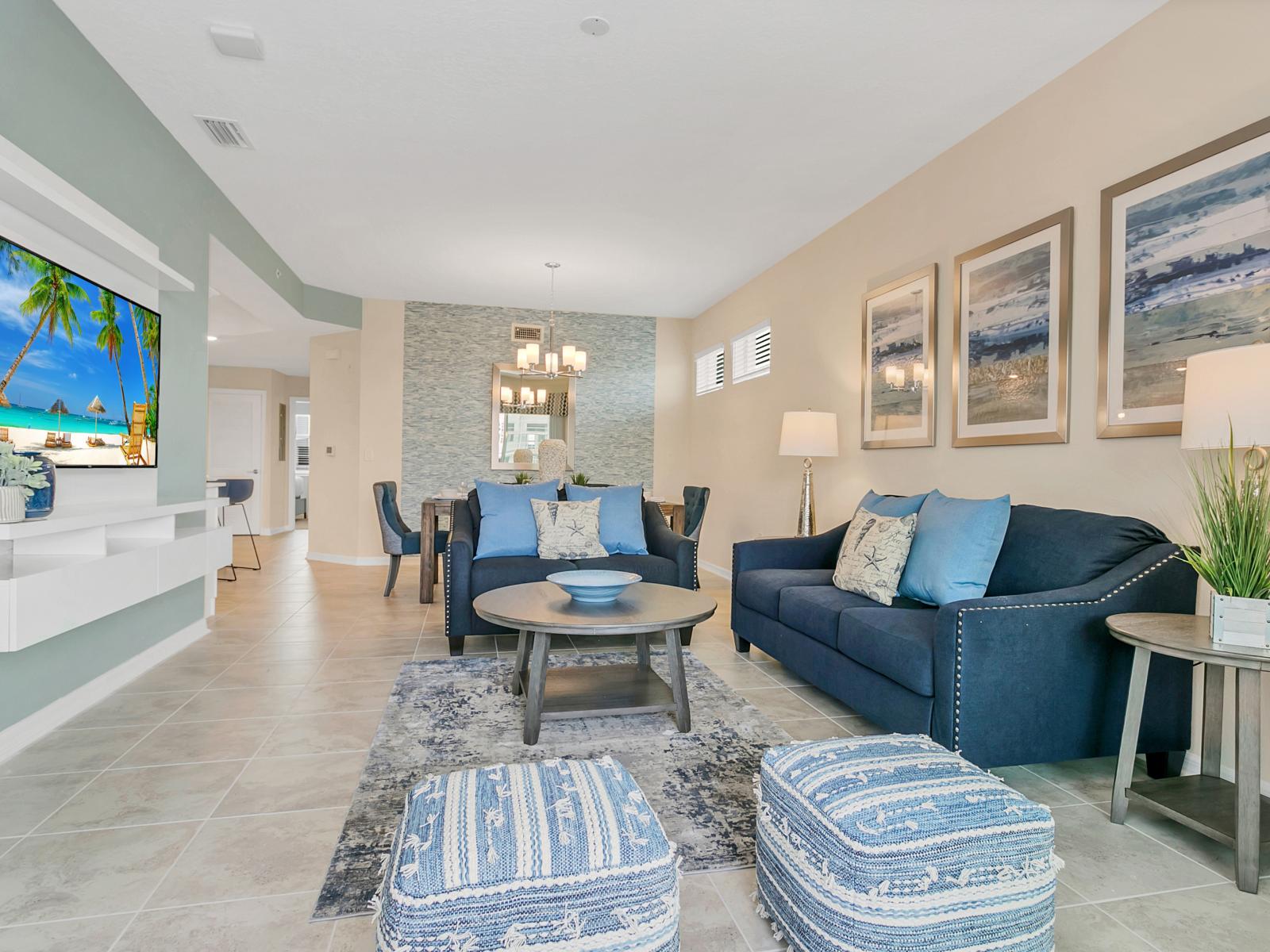 - Luxurious Living area of the condo in Kissimmee - Amazing sitting arrangement with cozy sofas - Elegantly balcony facing living area - Stunningly decored with big size wall paintings - Smart TV available for entertainment