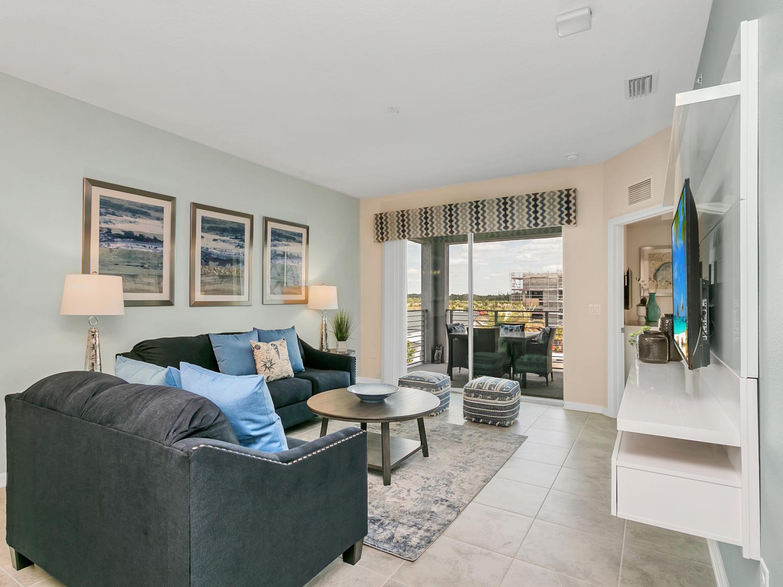 - Luxe living area of the condo in Kissimmee  - Comfy sitting sofas - Smart TV and Netflix available - Amazing glass doors that leads to the private balcony - Gloriously decored space to enhance the ambiance - Completely bright and airy space