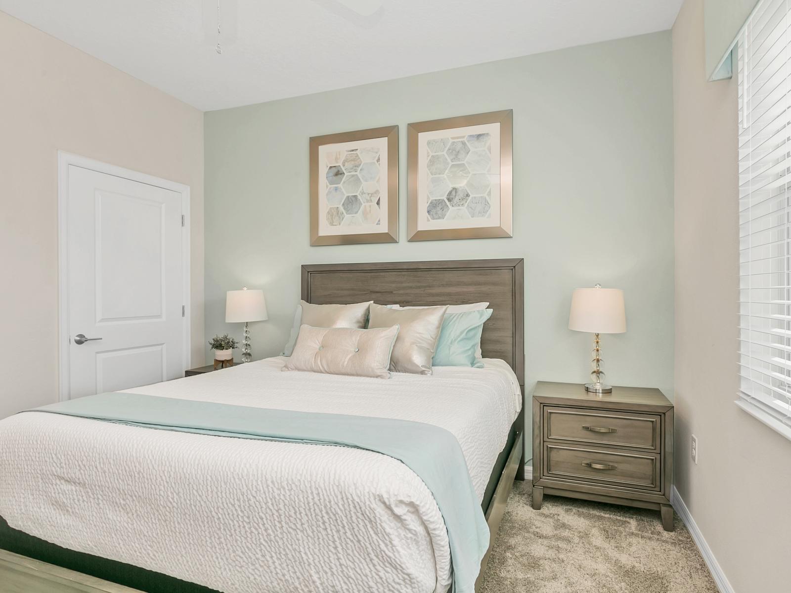 - Lavish bedroom of the condo in Kissimmee - Featuring a comfy double bed - Stunningly located bedside window for ventilation - Amazingly decored with aesthetic wall paintings - Majestic side table lamps - Beautifully painted walls