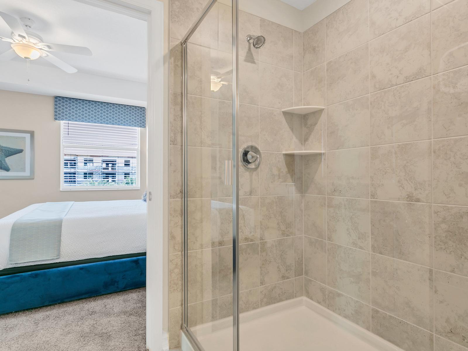 - Stunningly designed shower area of the bedroom attached bathroom of the condo in Kissimmee - Gloriously glass enclosed walk-in shower area - Amazingly tiled shower area - Experience the amazing shower area in a refreshing environment