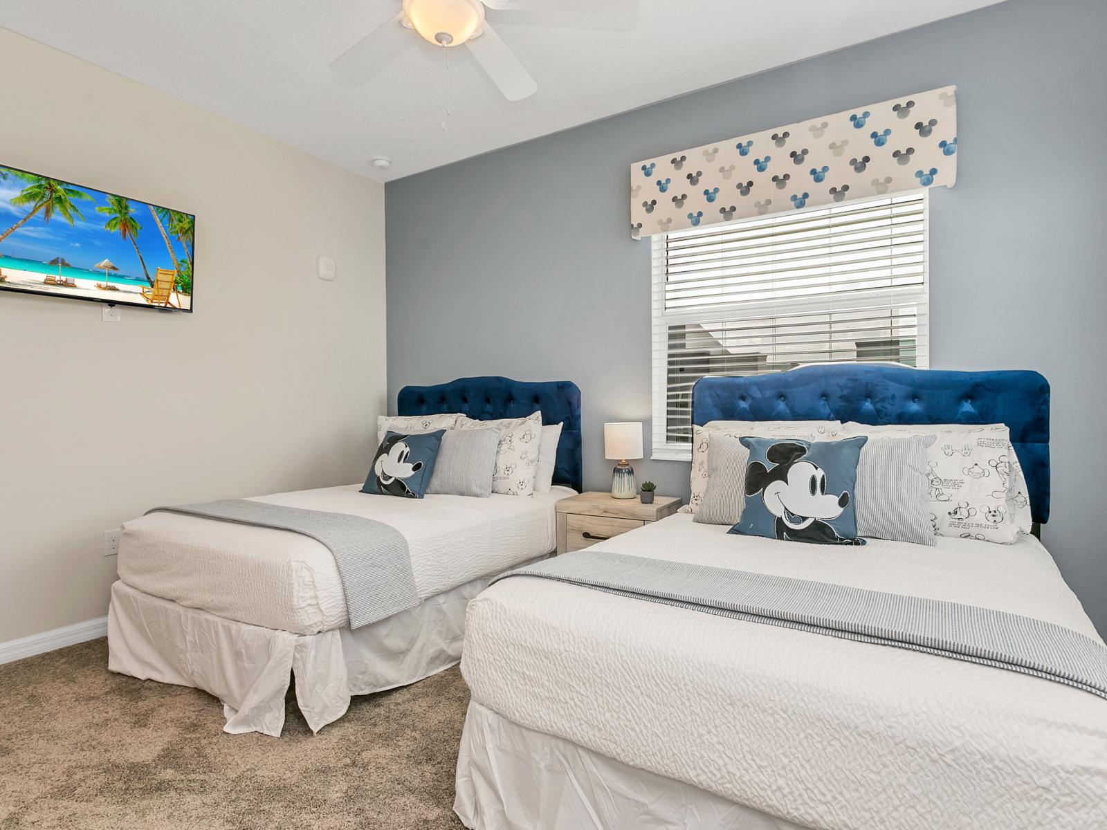 - Spectacular bedroom of the condo in Kissimmee - Cozy beds with neat and clean linen and soft pillows - Marvelously Mickey Mouse themed decor - Availability of smart Tv and Netflix - Windows for light and air and amazing views