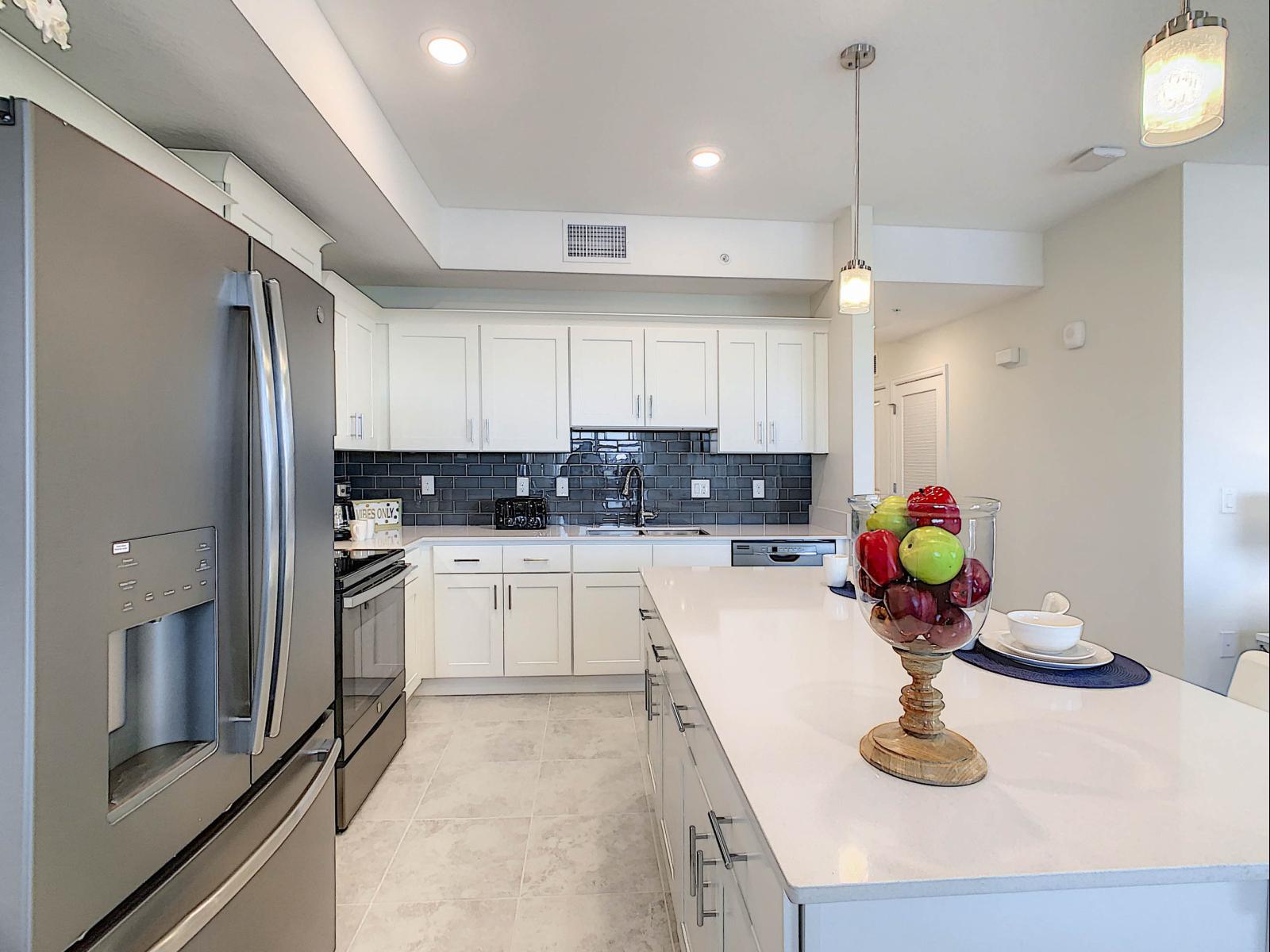 Cooking in Style: Our condo's kitchen is a chef's dream, fully furnished with contemporary flair, creating a space where cooking becomes a stylish affair