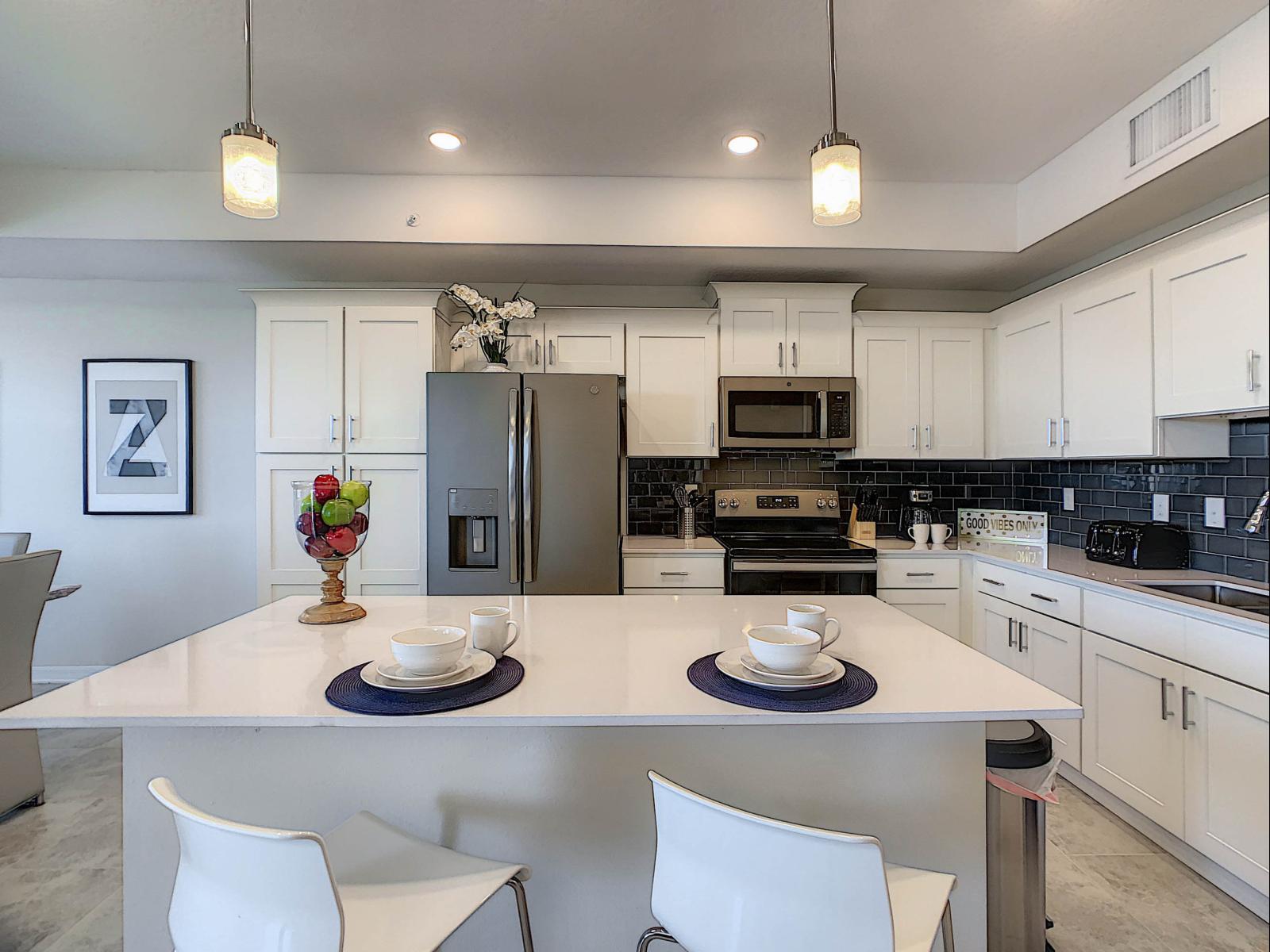 Cooking in Style: Our condo's kitchen is a chef's dream, fully furnished with contemporary flair, creating a space where cooking becomes a stylish affair