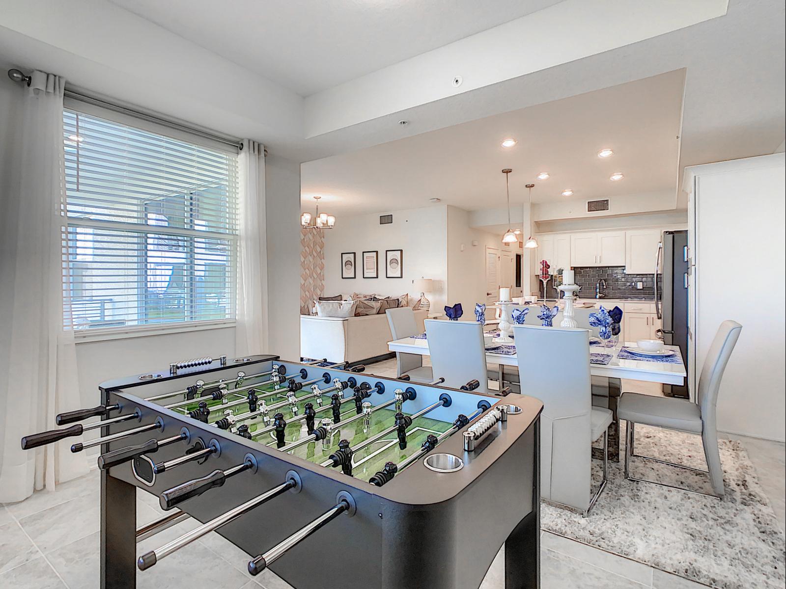 Get ready for some fun, a foosball table awaits, making this space perfect for entertaining - Open layout lets you move seamlessly between dining, gaming, and relaxing - Play, dine, and unwind, this home offers a lively mix of leisure and comfort