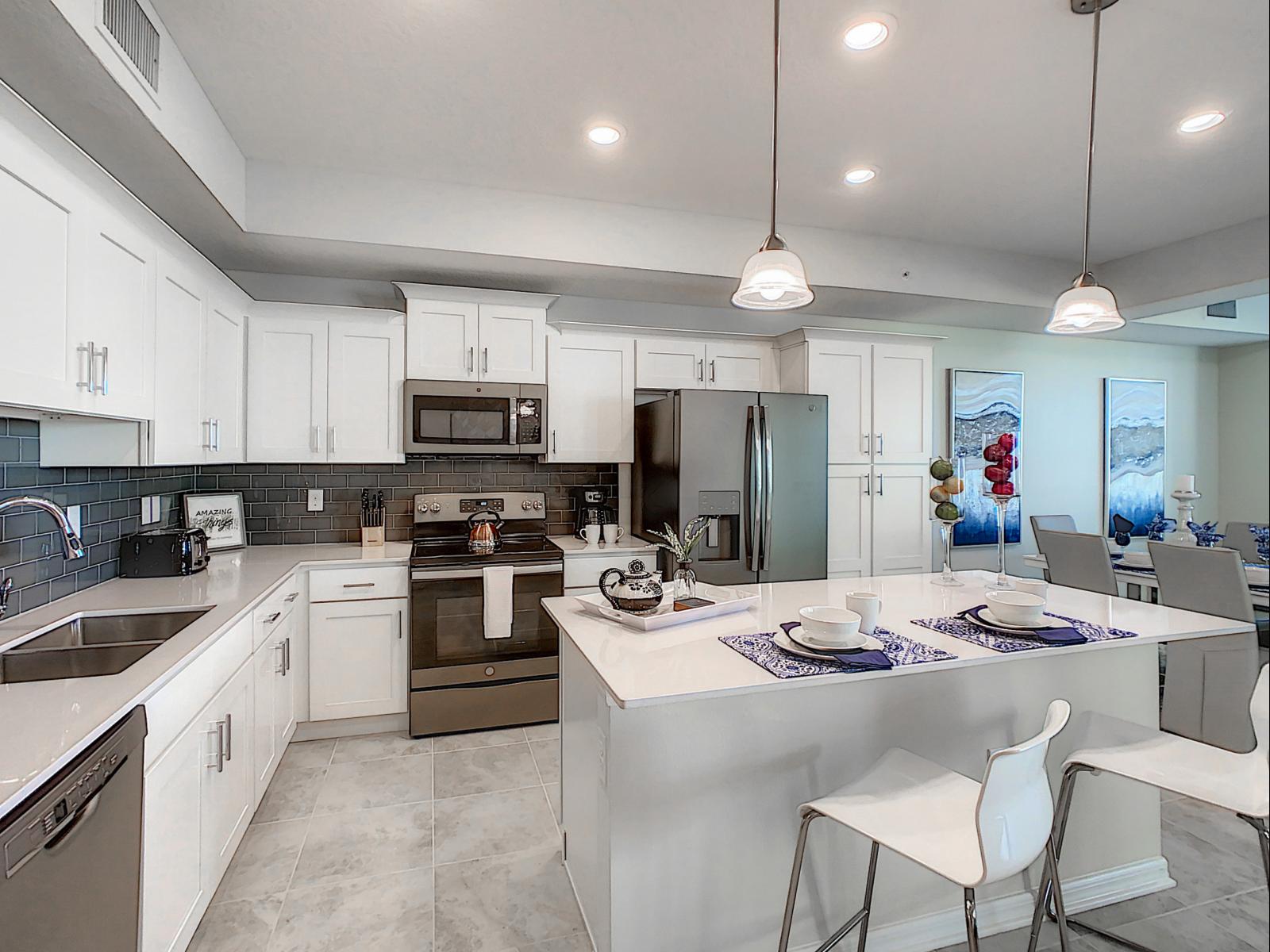 Stylish kitchen featuring an island and modern decor - Thoughtfully designed with storage and elegant lighting for an enjoyable cooking experience - Open concept layout flows effortlessly into the dining and living areas, perfect for entertaining