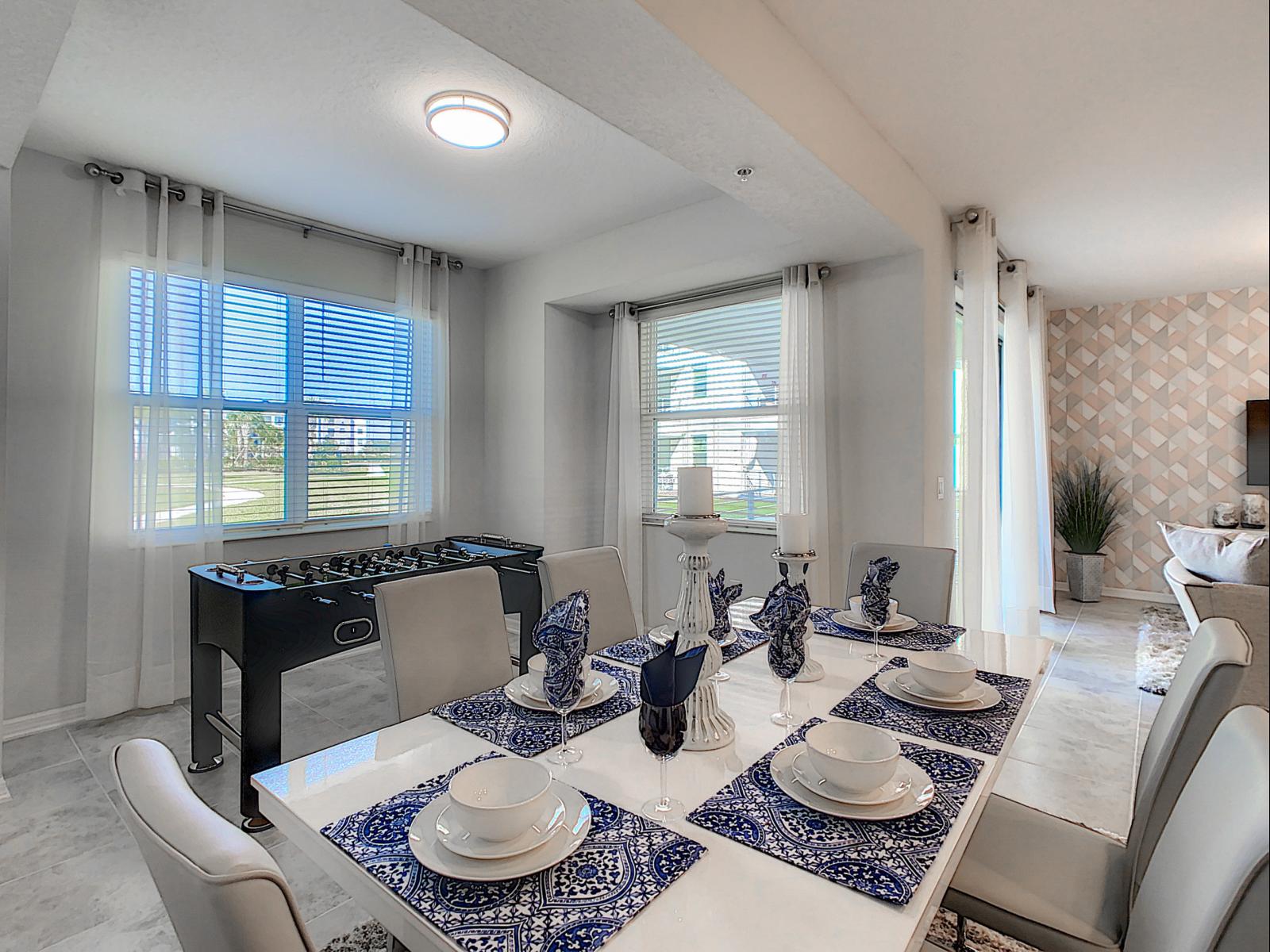 Dine in style with a view, this room combines modern decor with sunny, inviting vibes - From the patterned placemats to the chic table decor, elevate every meal - With large windows and natural light, this space feels bright and welcoming