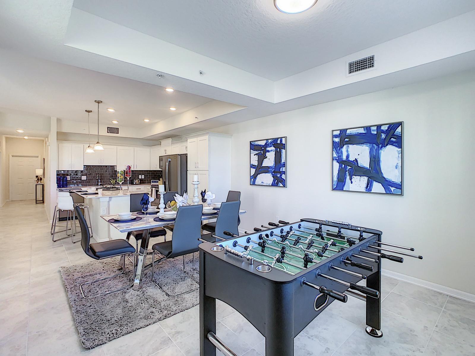 Entertainment Elegance: Our dining area, with elegant chairs and a game table, offers a curated space that seamlessly transitions from refined dining to exciting gaming