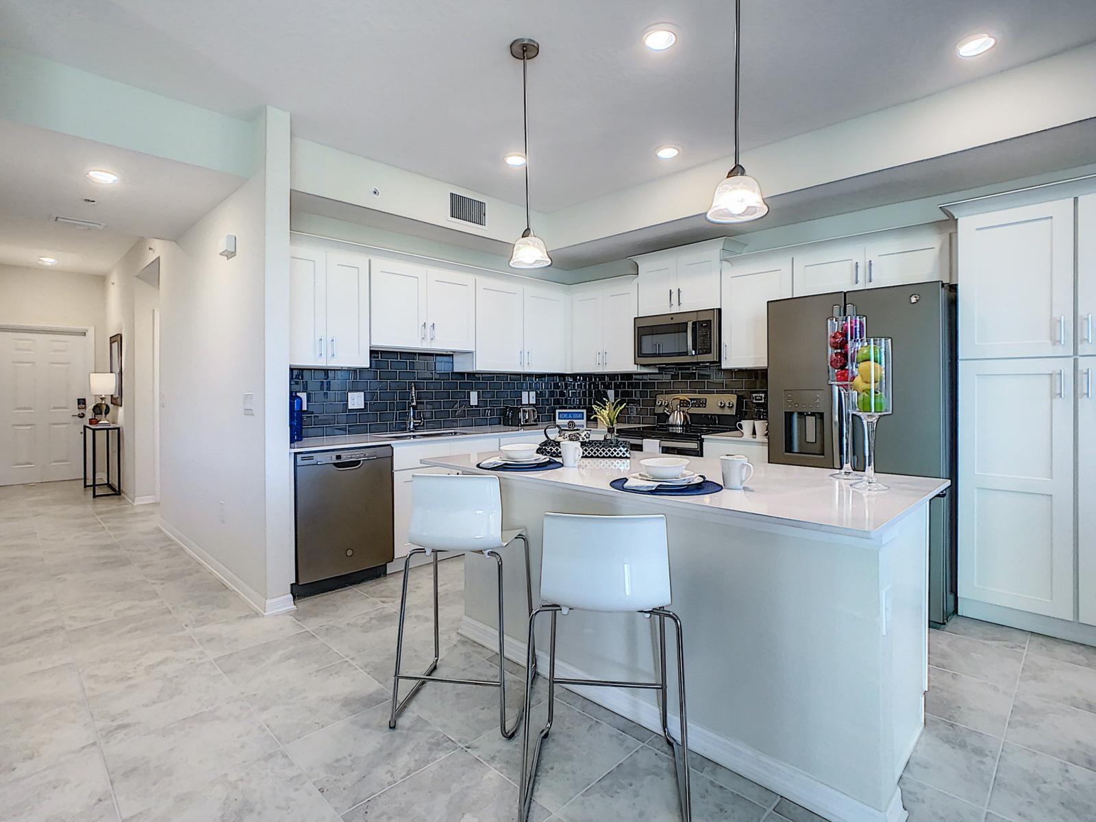 Cooking in Style: Our condo's kitchen is a chef's dream, fully furnished with contemporary flair, creating a space where cooking becomes a stylish affair