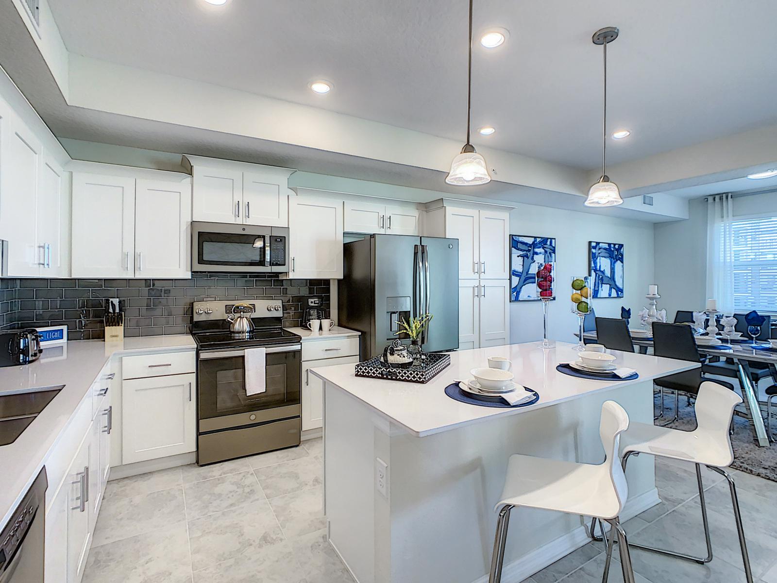 Cooking in Style: Our condo's kitchen is a chef's dream, fully furnished with contemporary flair, creating a space where cooking becomes a stylish affair