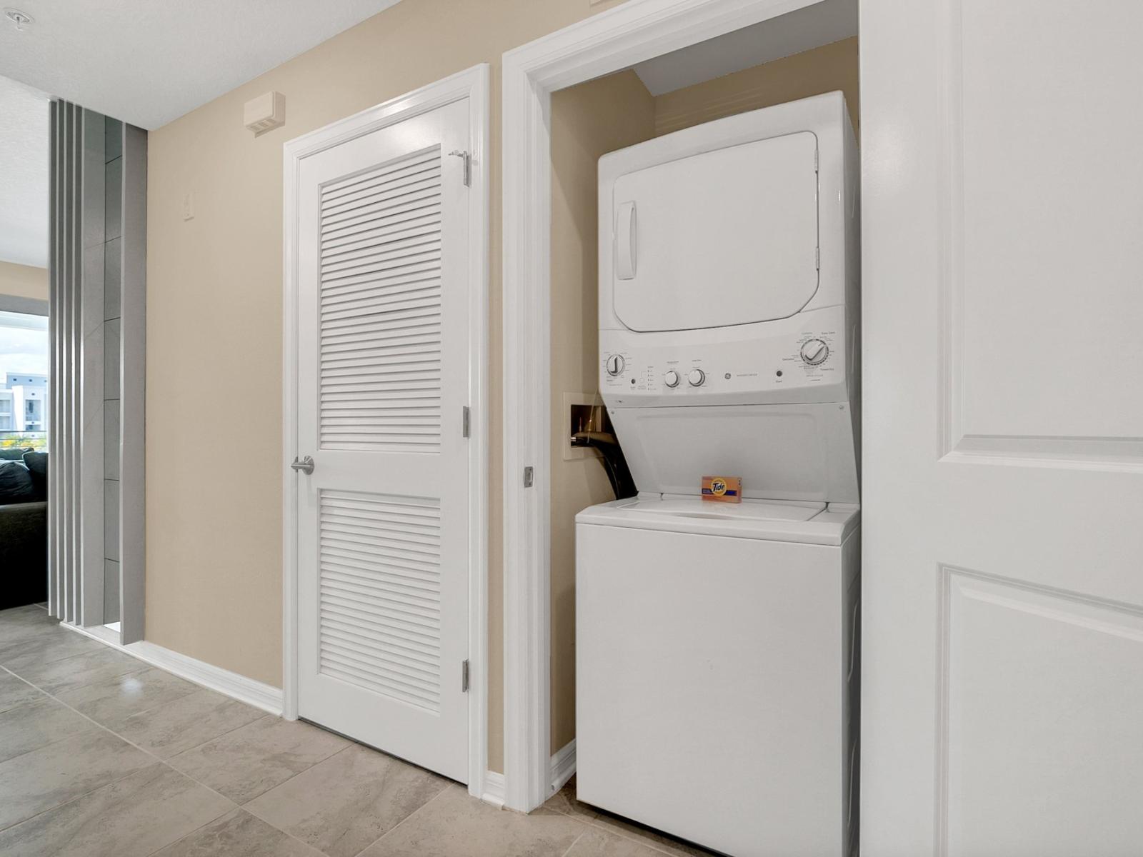 Laundry area with full washer and dryer of the condo in Kissimmee Florida - Take advantage of modern laundry facilities - Making it easy for you to keep your wardrobe in top condition