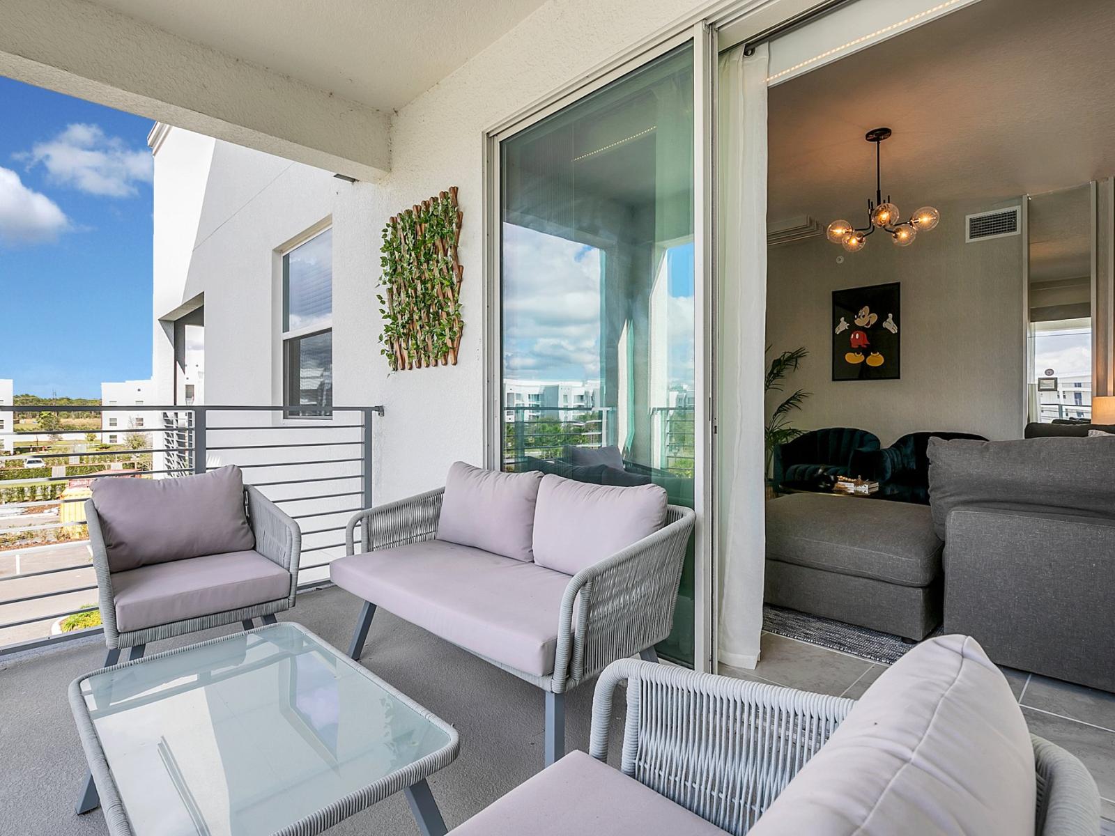 Lush private balcony of the condo in Kissimmee Florida - Enjoy outdoor seating and spectacular views from the balcony - Perfect for relaxing evenings and morning coffee conversations - Enhance your living experience with a personal balcony