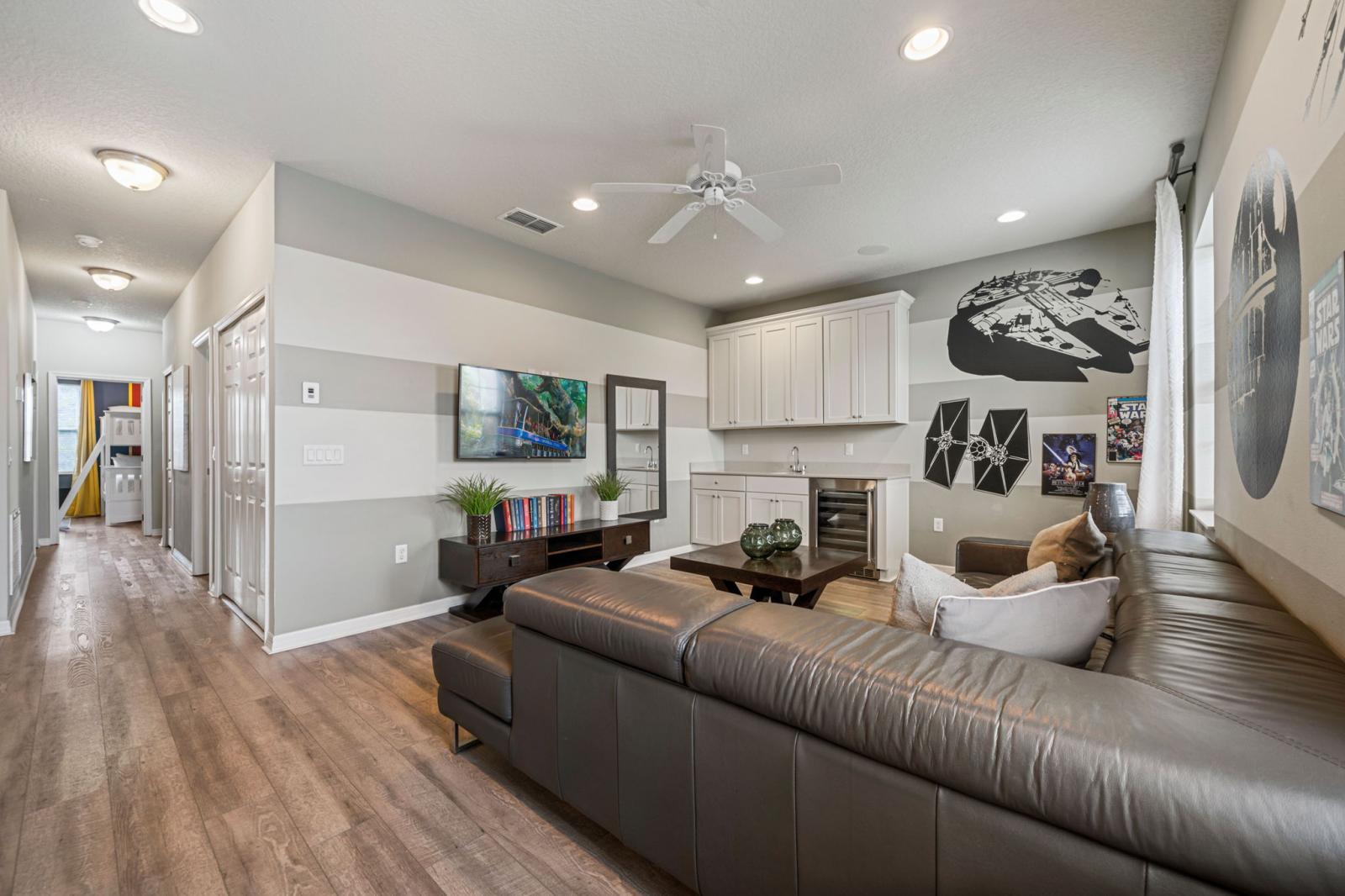 Loft area with a large Smart Tv and seating area