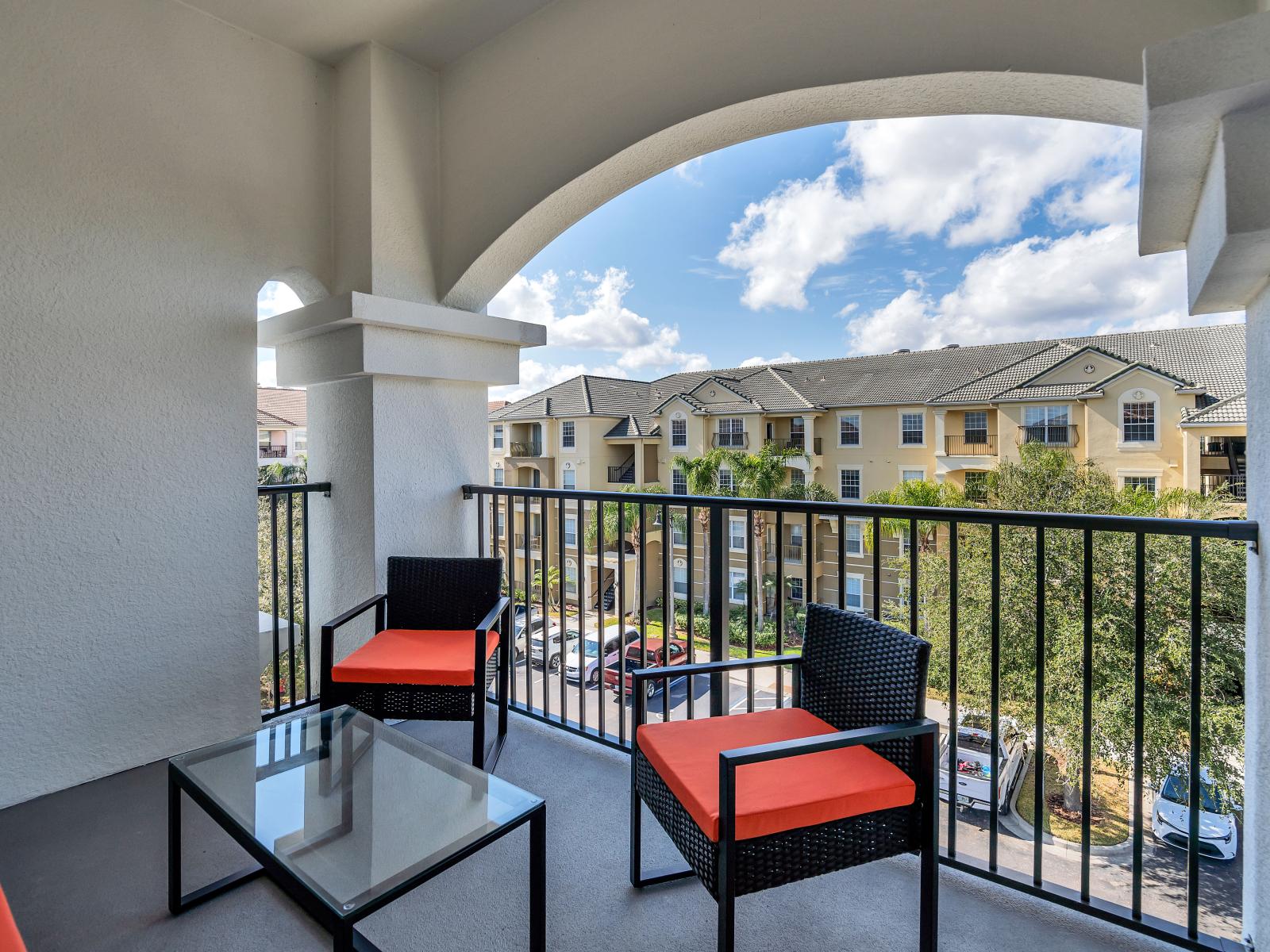 Step outside on our inviting private balcony of the condo in Orlando - Complete with comfortable seating – a tranquil retreat where you can soak in the beauty of the surroundings and enjoy moments of relaxation.