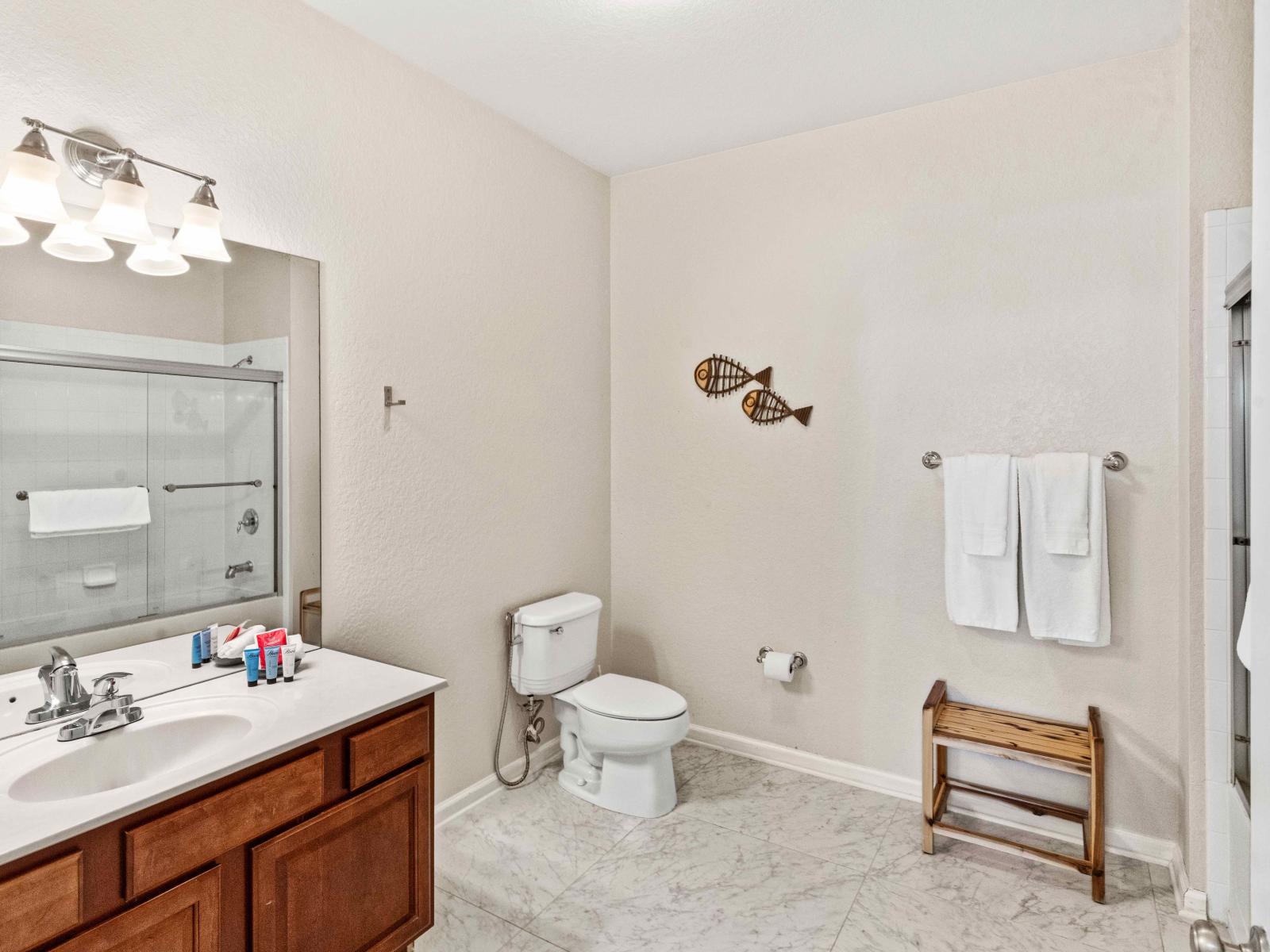 Bathroom 2 with a bathtub and a shower combo