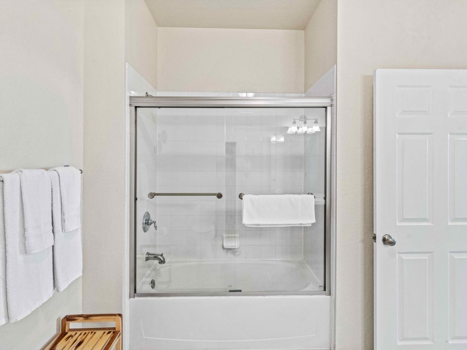 Bathroom 2 with a bathtub and a shower combo