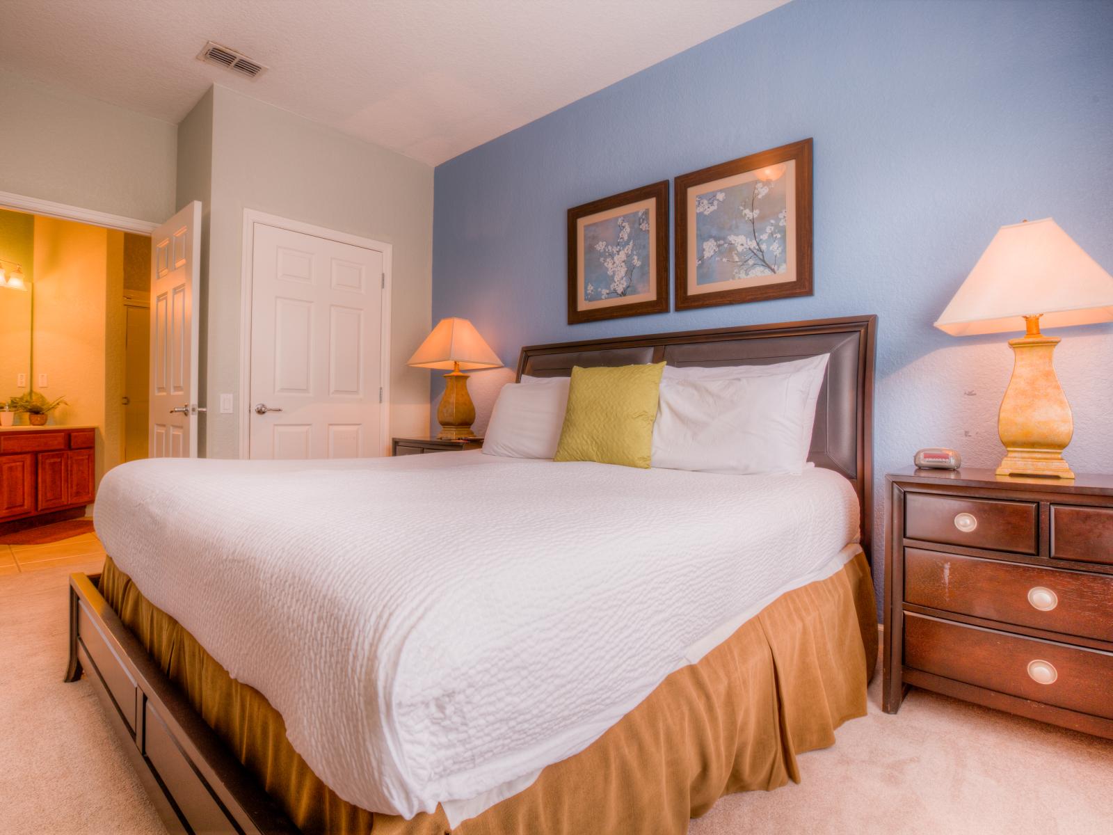 Step into the bedroom at Vista Cay Resort, where comfort and style converge to create a serene haven for rest and relaxation, ensuring a peaceful night's sleep .