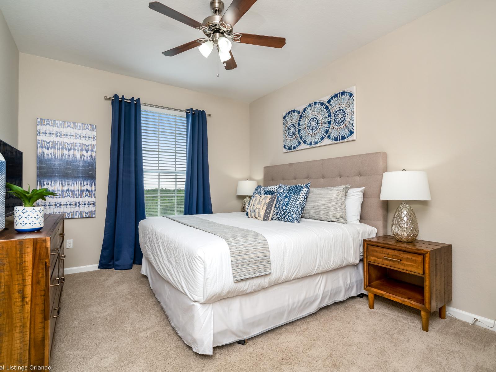 The main bedroom features a luxurious king-sized bed, offering a comfortable and inviting retreat for a restful night's sleep. With its elegant design and cozy ambiance.