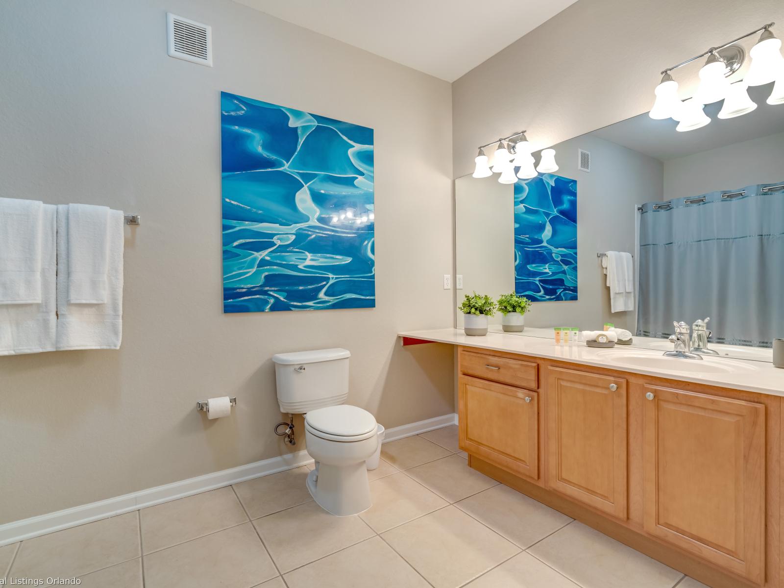 Relax and rejuvenate in the second bathroom's tub/shower combination. Whether you prefer a leisurely soak or a quick refreshing shower, this versatile bathroom provides the perfect space for your bathing needs.