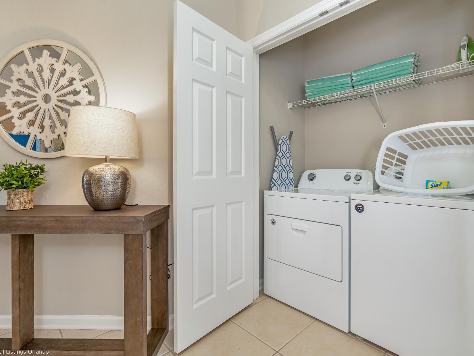 Conveniently located within the apartment, the laundry area boasts a full-size washer and dryer, ensuring that you can easily keep your clothes fresh and clean throughout your stay.