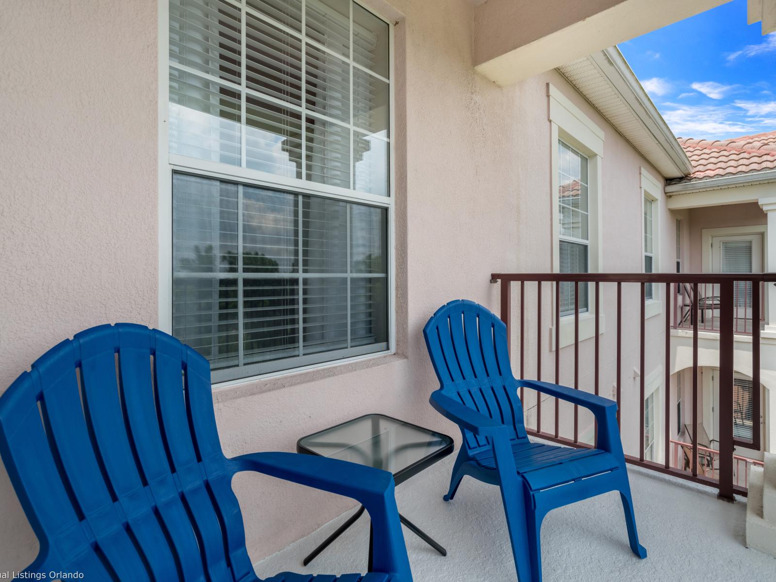 Step out onto this balcony and immerse yourself in the vibrant atmosphere of Vista Cay Resort. With the clubhouse and main pool just steps away, enjoy convenient access to resort amenities and endless relaxation.