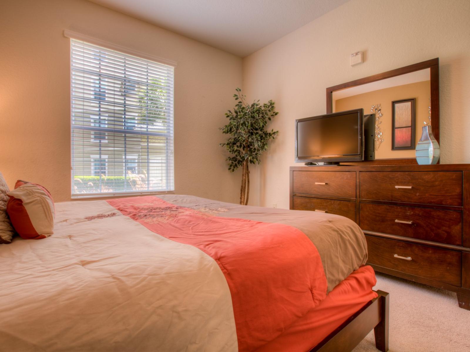 Entertainment Haven: Relax in this inviting bedroom retreat, complete with a TV for your viewing pleasure. Unwind in comfort and style as you enjoy your favorite shows and movies in this cozy sanctuary.