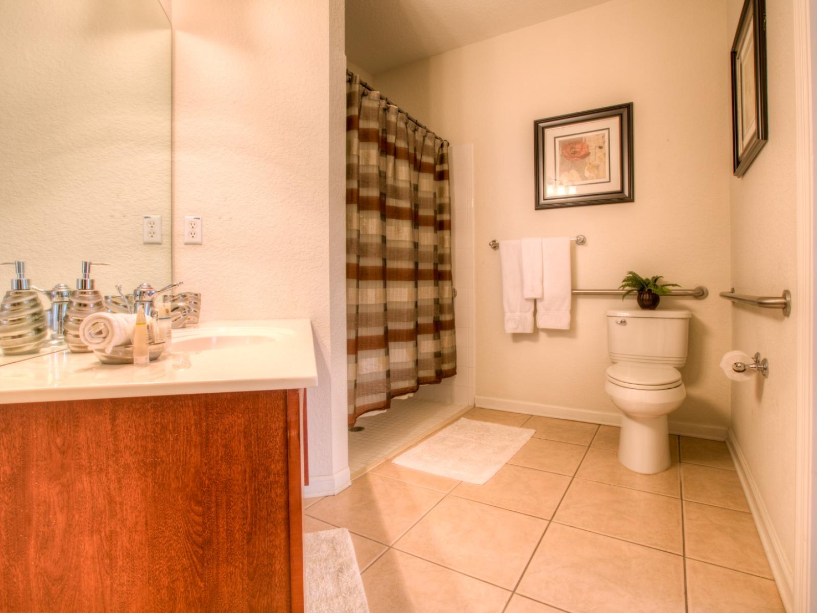 Experience luxury and convenience in the ensuite bathroom, a tranquil retreat for ultimate relaxation.