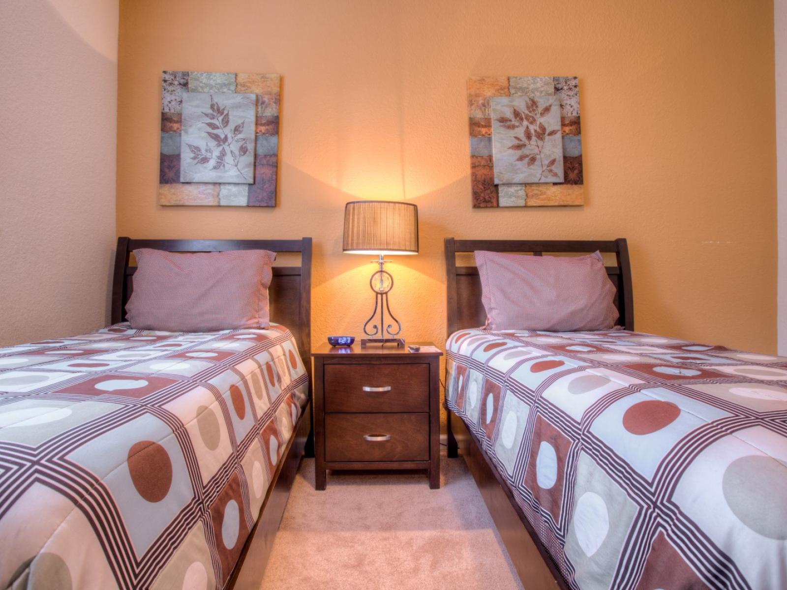 Relax and unwind in our inviting bedroom with two beds. Perfect for families or friends traveling together, this cozy space offers double the comfort for a restful night's sleep.