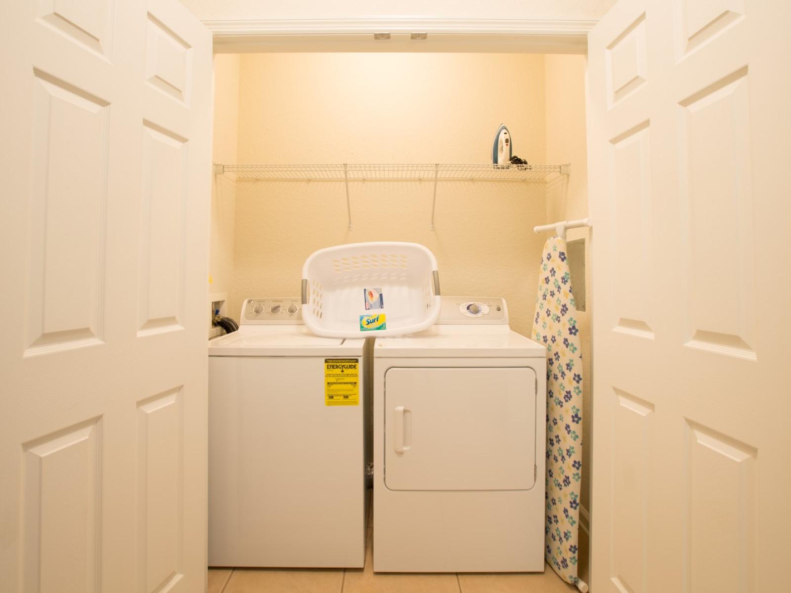 The laundry area boasts a full-size washer and dryer, ensuring that you can easily keep your clothes fresh and clean throughout your stay.