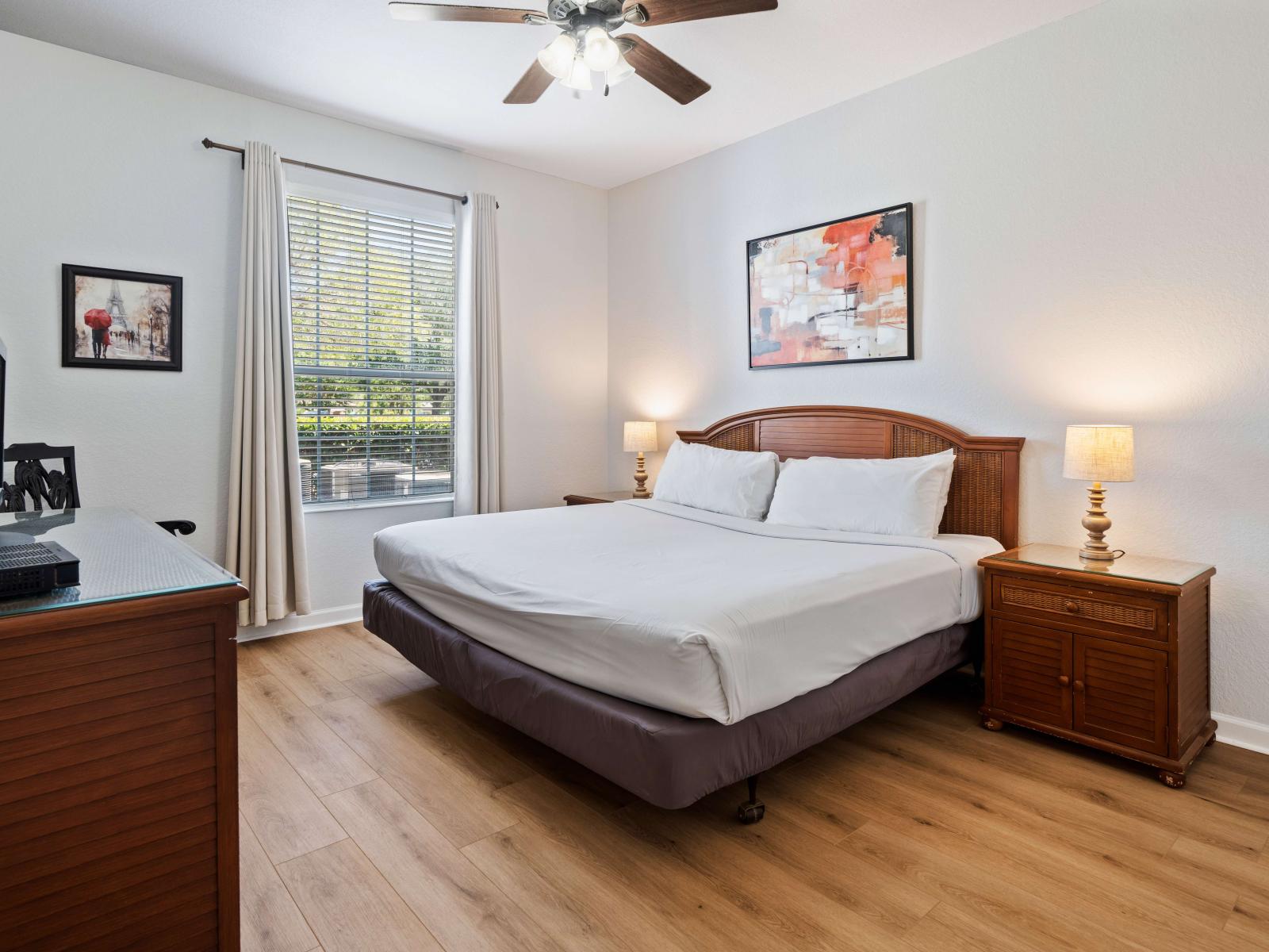 Enjoy the serene ambiance of the third bedroom, featuring a king bed, smart TV, and convenient en-suite bathroom.