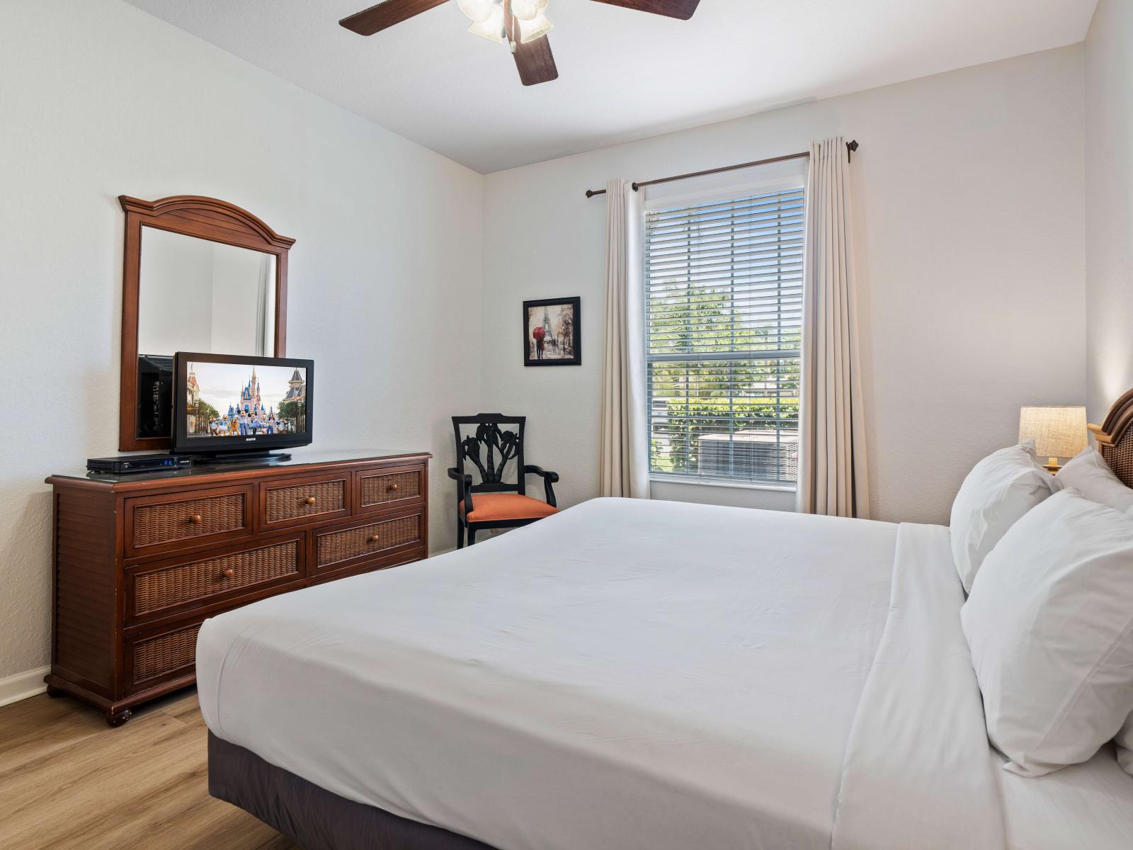 Feel at home in the third bedroom, offering a king bed, smart TV, and luxurious en-suite bathroom