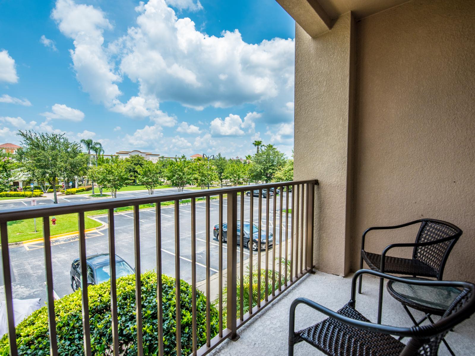 Sit back and relax while enjoying the view of the city in this private balcony.