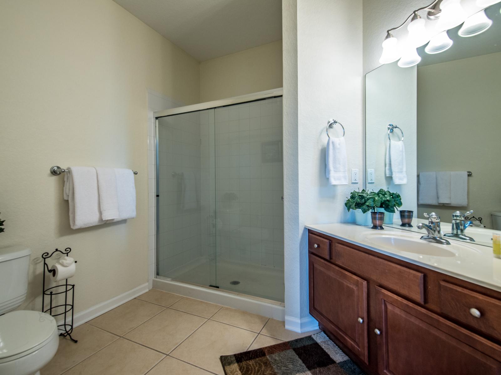 What could be better than a warm, comforting shower in this neat and spotless bathroom with walk-in shower.