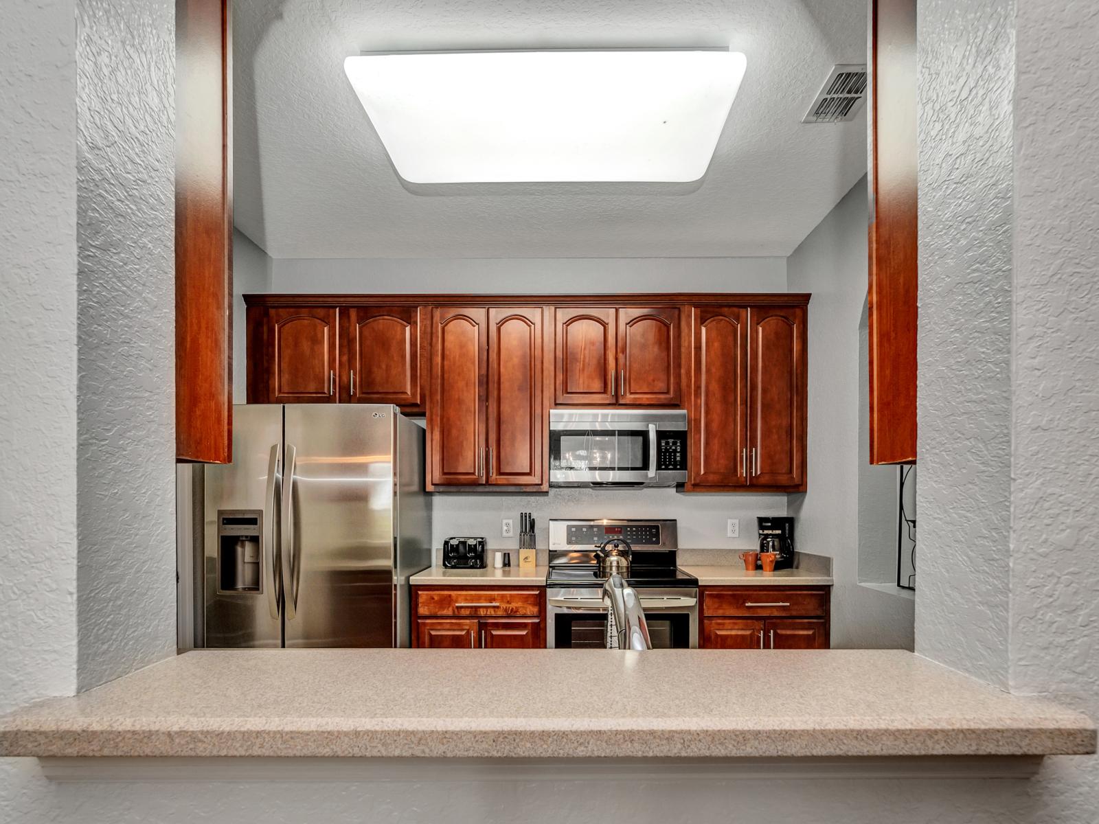 Luxurious kitchen of the condo in Orlando - Fully equipped with all necessary kitchen accessories - Elegant lighting - Sufficient space in the wardrobe to store goods - Plenty of space to work easily