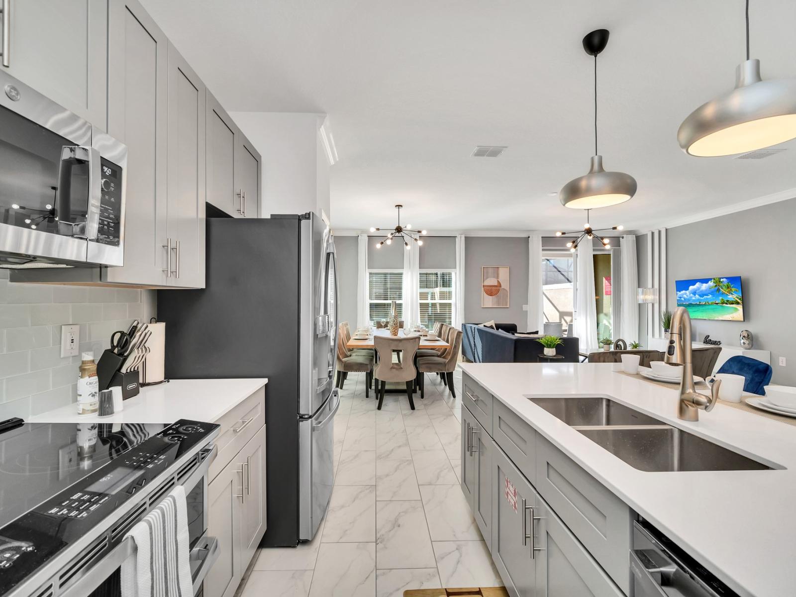 The kitchen is a culinary haven, featuring modern appliances, sleek countertops, and ample storage.