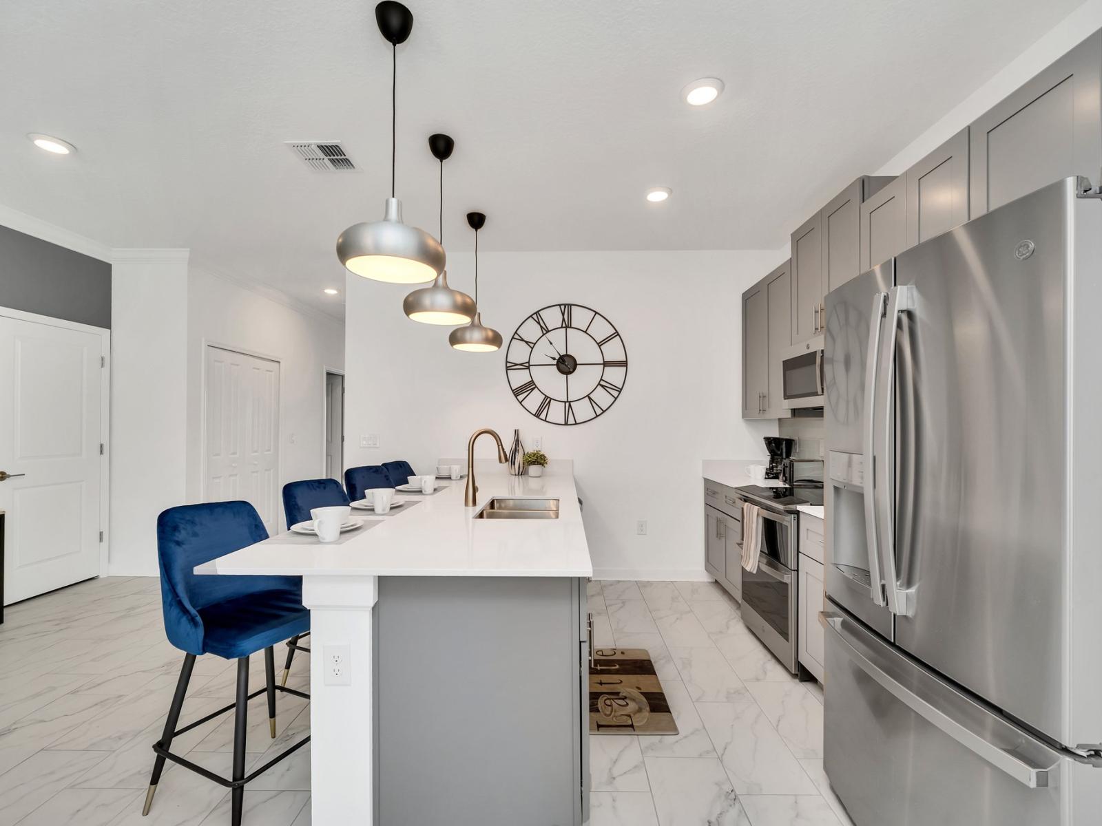 The kitchen's  stylish design and functional layout provides the perfect setting for preparing delicious meals and enjoying culinary adventures.