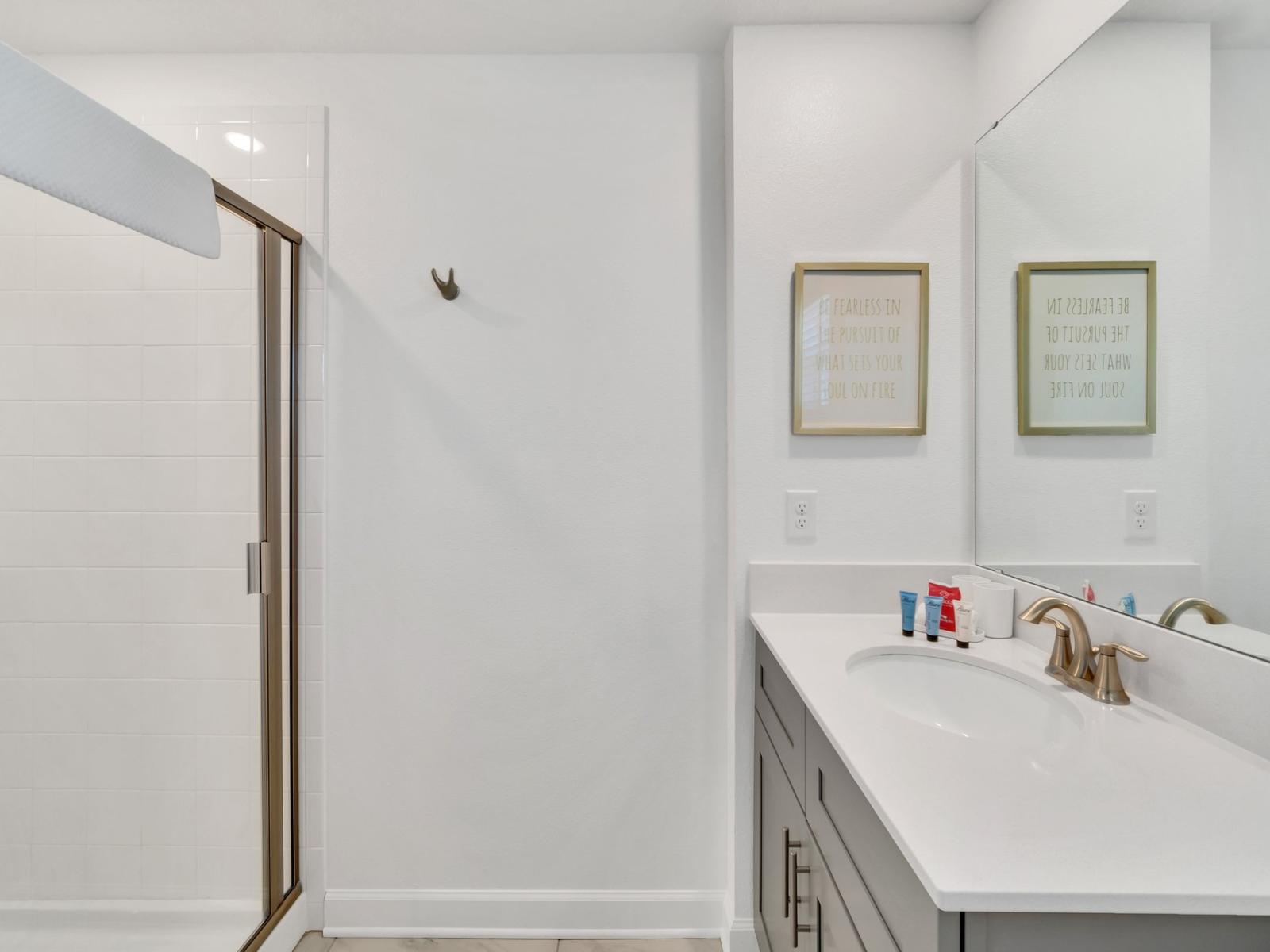 Vanity Space and Bathing Haven: A luxurious retreat featuring a well-appointed vanity area alongside a relaxing walk-in shower area, offering the perfect blend of functionality and relaxation.