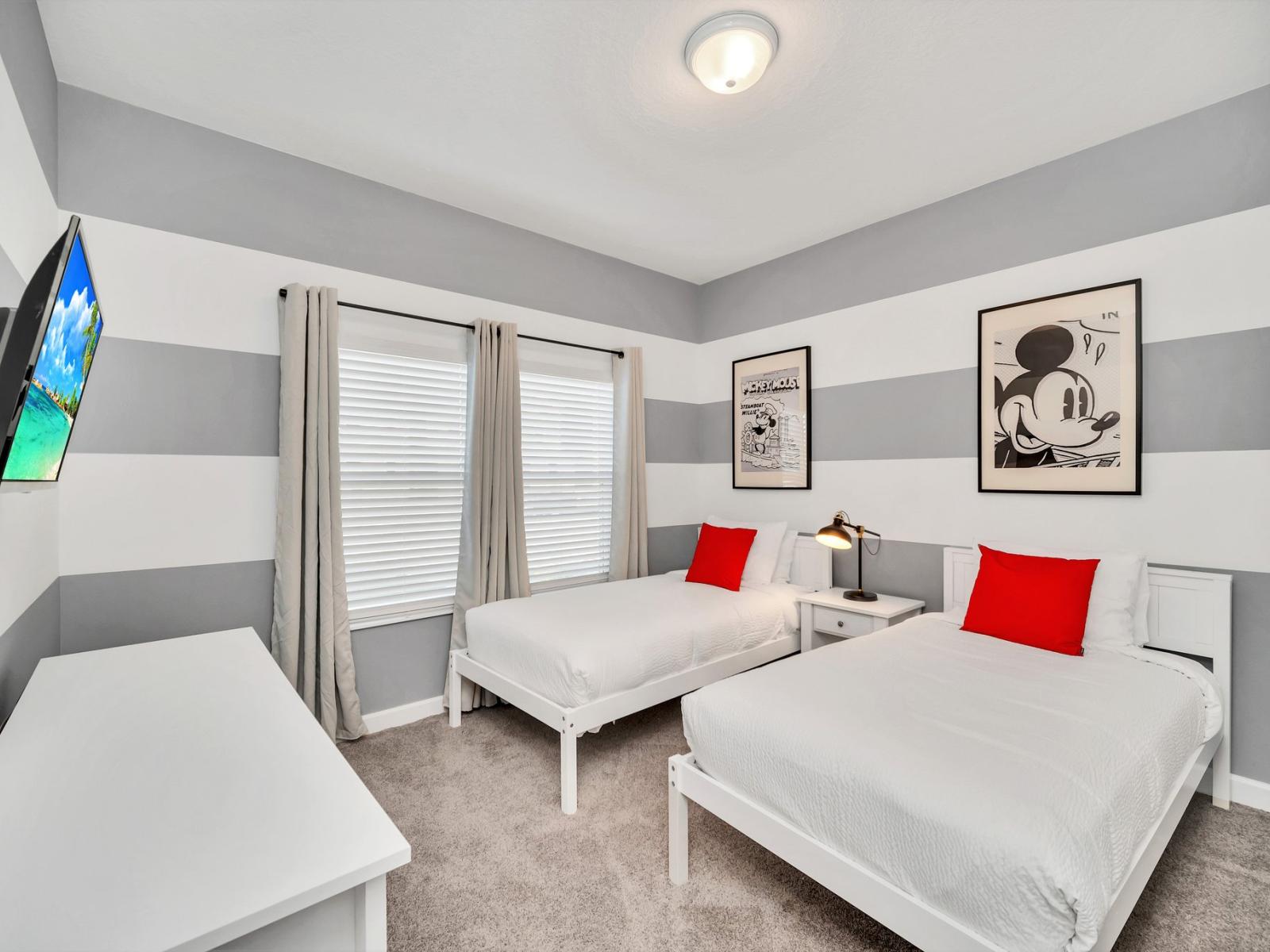 Mickey mouse themed bedroom of the townhouse in Kissimmee Florida - Cozy and inviting ambiance for relaxation - Offering two single beds - Harmonious color palette creating a soothing atmosphere