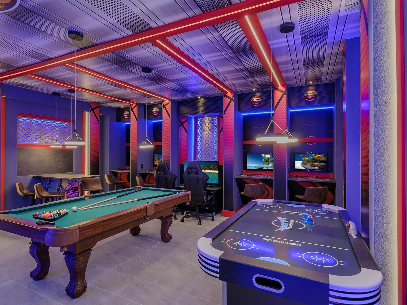 Exciting game room of the home in Kissimmee Florida - A variety of classic and modern games to suit all tastes - A haven for gamers and enthusiasts alike to indulge their passions - Pool, Air hockey and consoles games