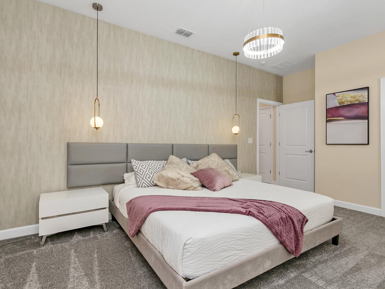 Spacious bedroom of the home in Kissimmee Florida - Modern and stylish decor that complements the space - Bedroom with a cozy ambiance, blending comfort and aesthetics - Stylish double bed design with plush bedding