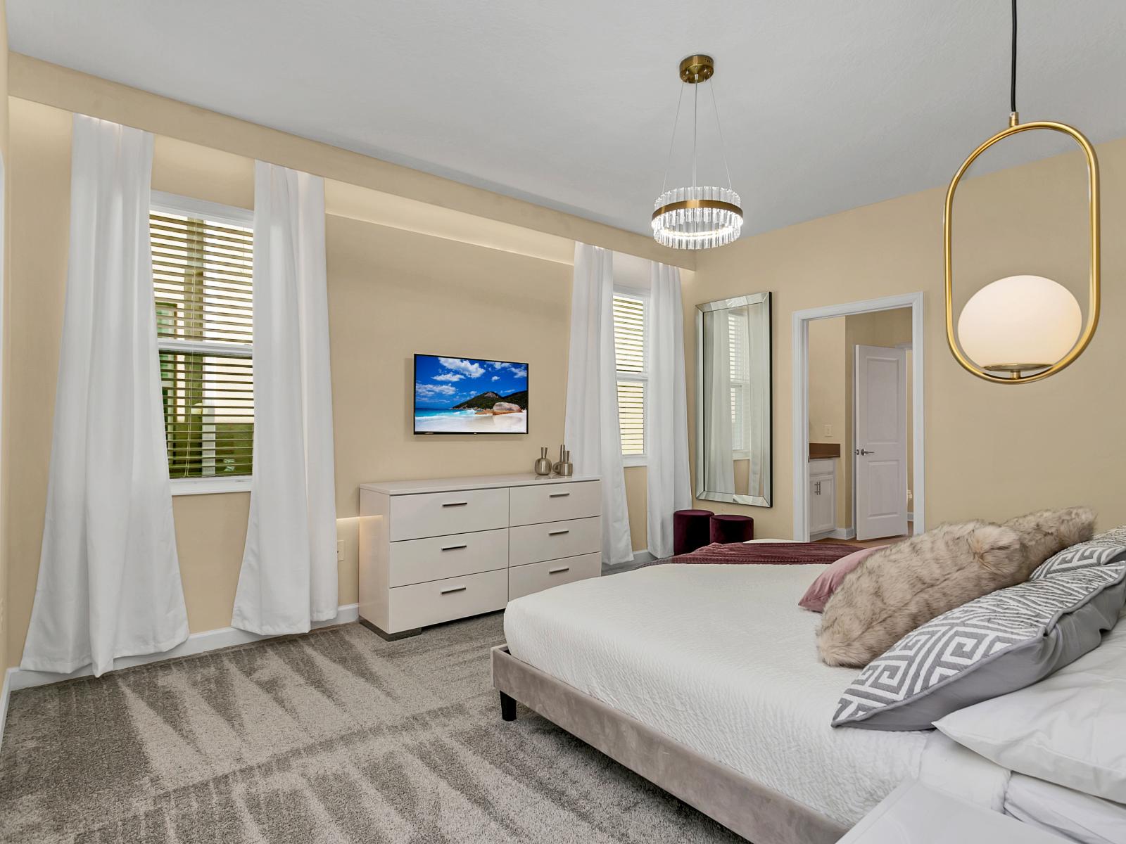 Relaxing in Luxury: This bedroom  showcases  Comfort with Elegant Pendant Lighting.