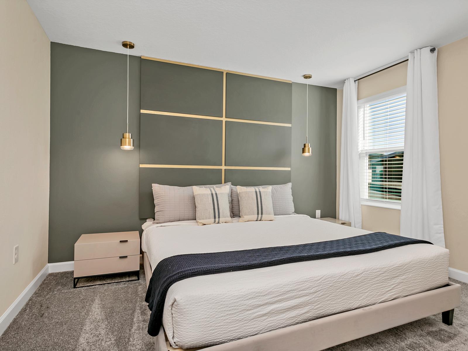 Modern bedroom of the home in Kissimmee Florida - Minimalist decor, creating a clean and uncluttered sleeping space - Cozy retreat with a plush bed - Tranquil bedroom retreat for restful nights