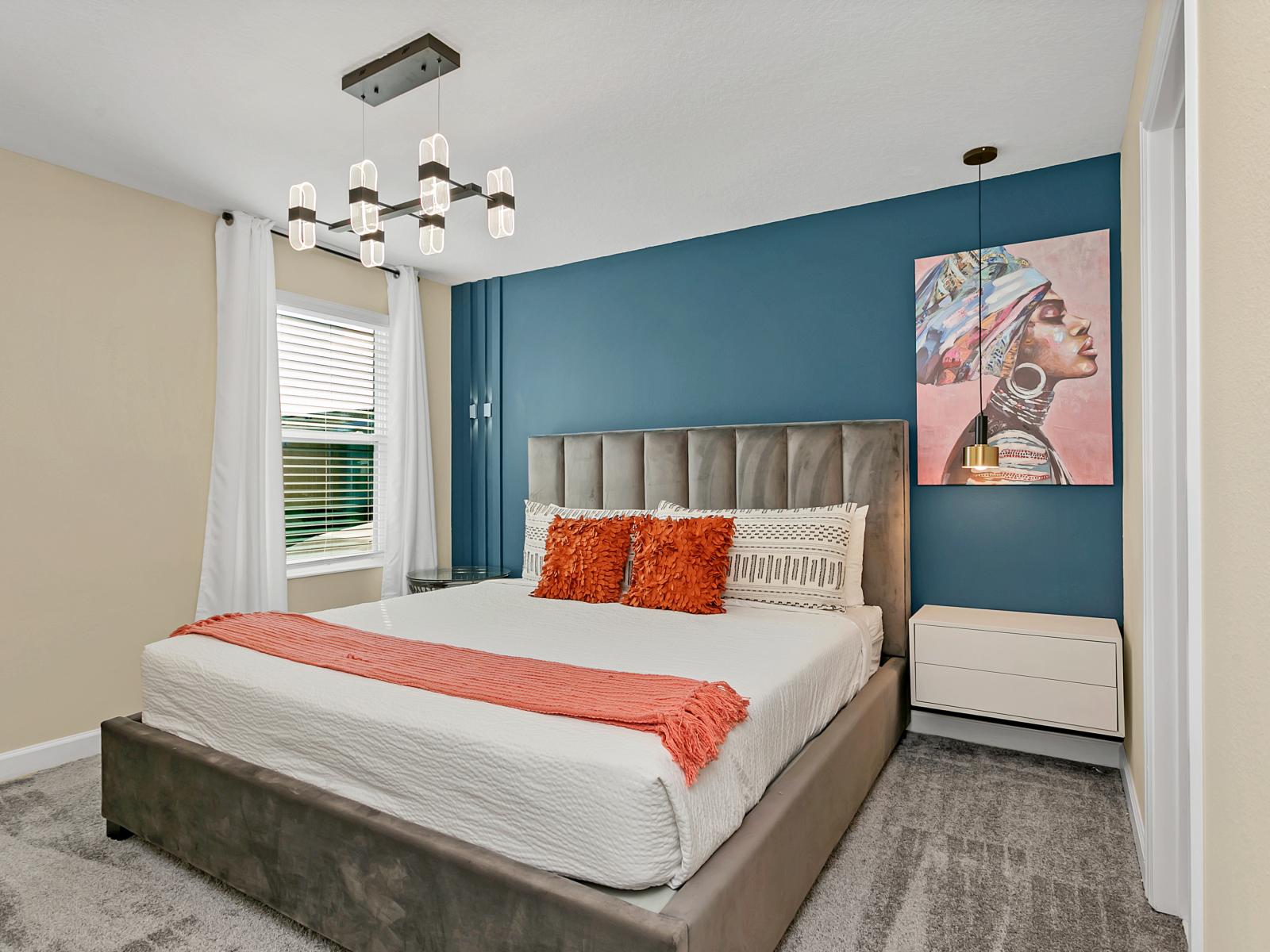 Enchanting bedroom of the home in Kissimmee Florida - Well-chosen lighting fixtures adding both functionality and charm - Thoughtfully designed bedroom featuring functional and stylish furniture - Modern and stylish decor that complements the space