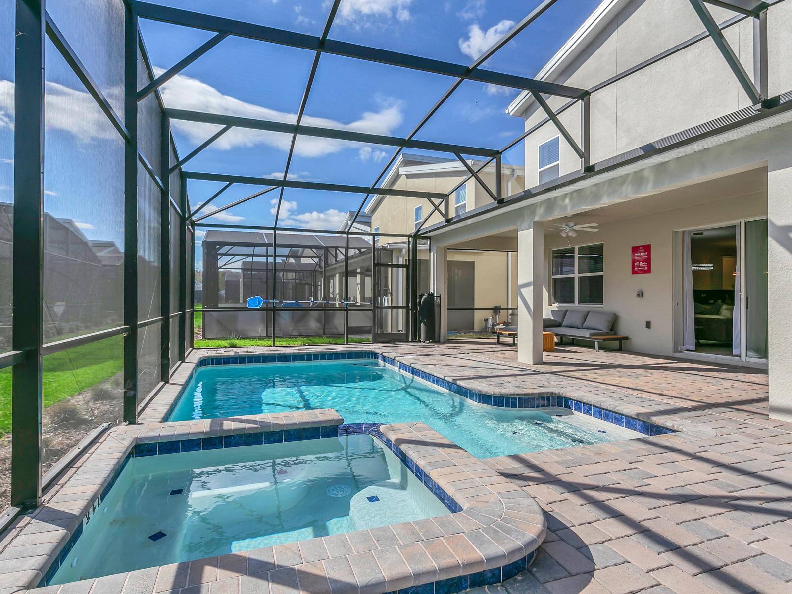 Revitalize in your private pool or relish the generous outdoor patio space, perfectly suited for entertaining, showcasing a secluded splash pool and abundant outdoor seating.